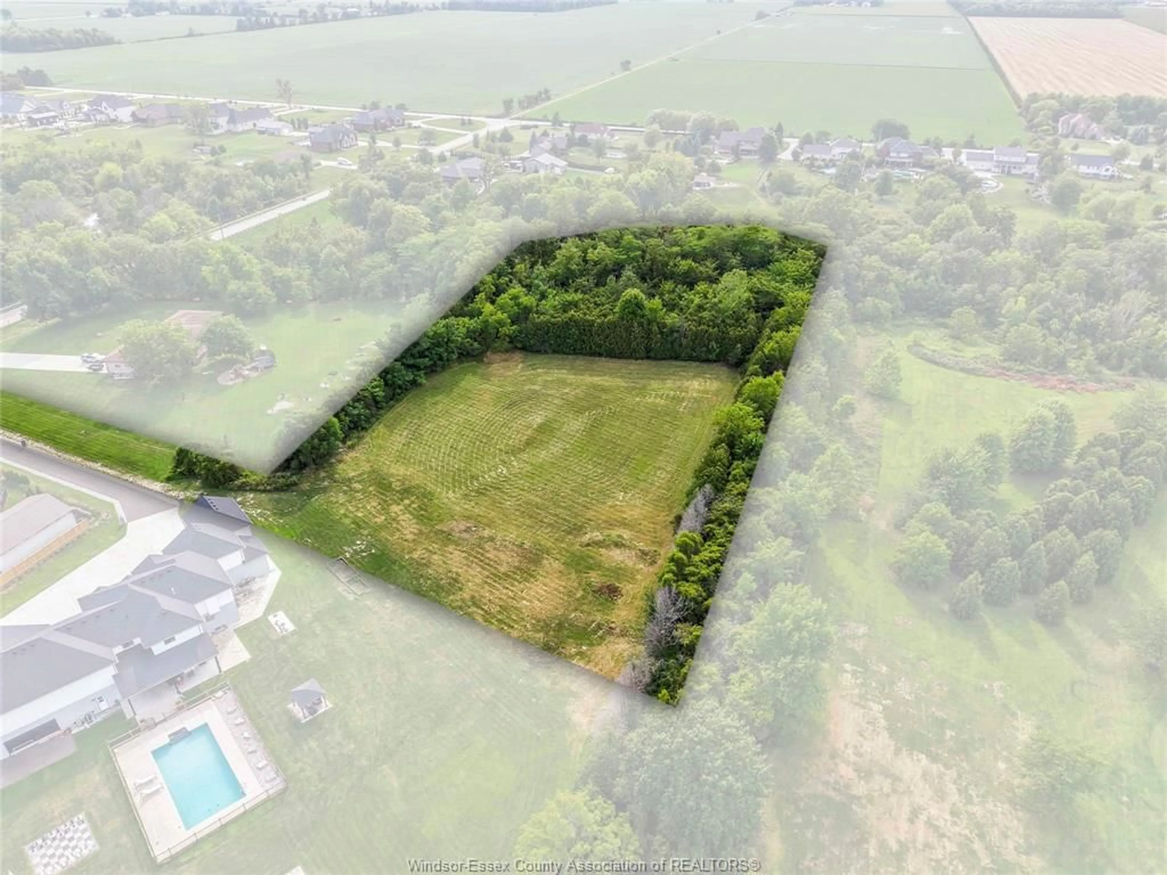 A pic from outside/outdoor area/front of a property/back of a property/a pic from drone, building for 57 BISSONNETTE Lane, Lakeshore Ontario N0R 1V0