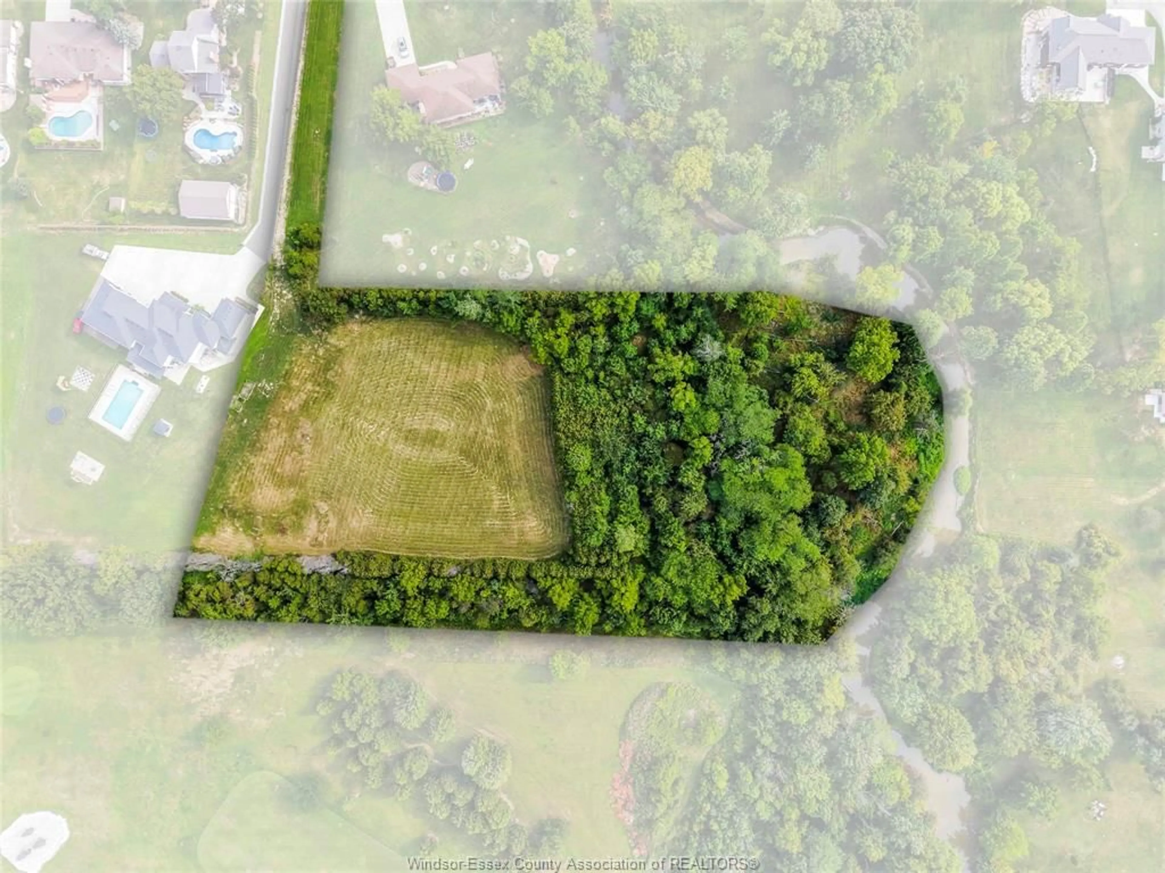 A pic from outside/outdoor area/front of a property/back of a property/a pic from drone, forest/trees view for 57 BISSONNETTE Lane, Lakeshore Ontario N0R 1V0