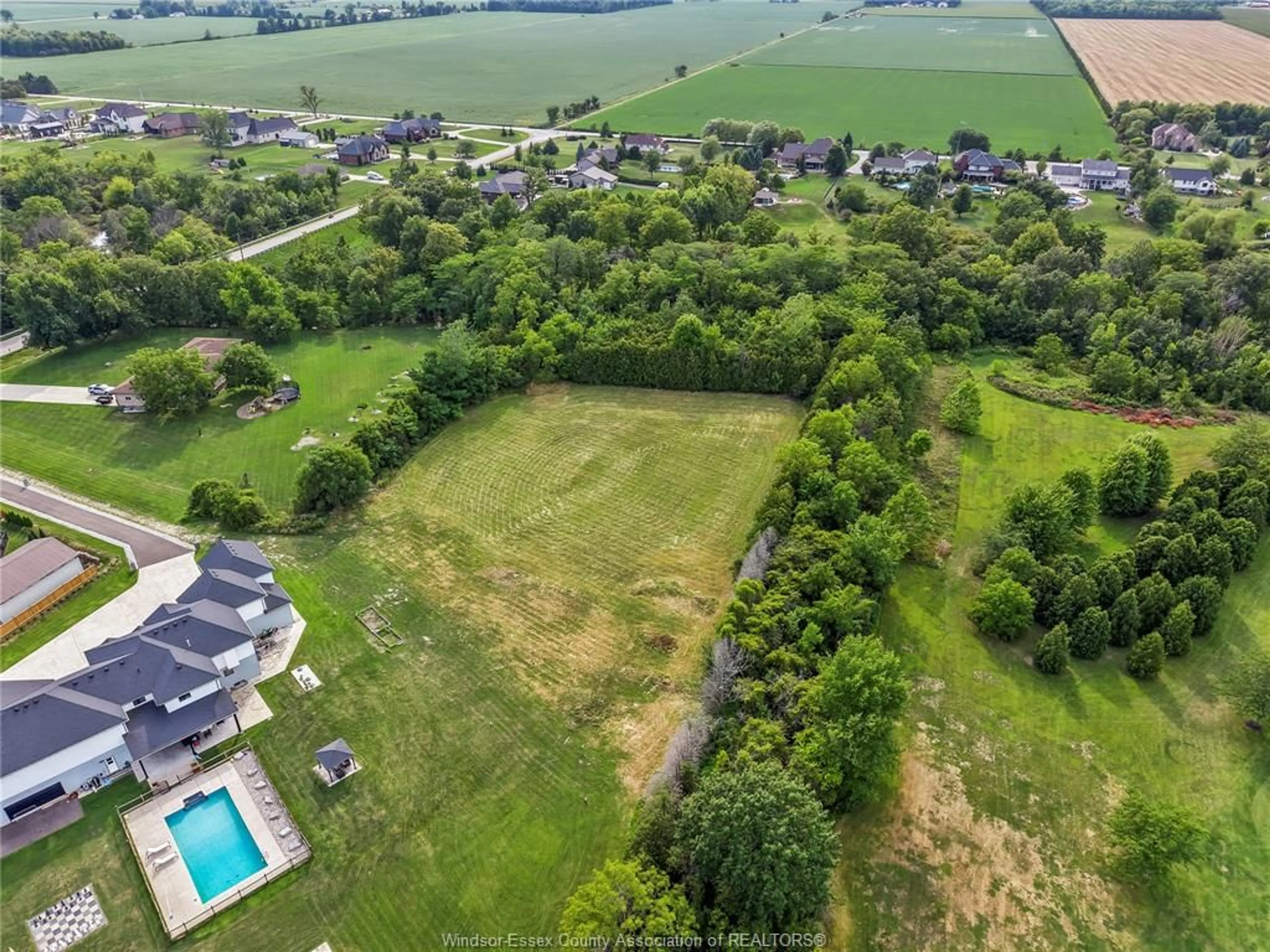 A pic from outside/outdoor area/front of a property/back of a property/a pic from drone, water/lake/river/ocean view for 57 BISSONNETTE Lane, Lakeshore Ontario N0R 1V0
