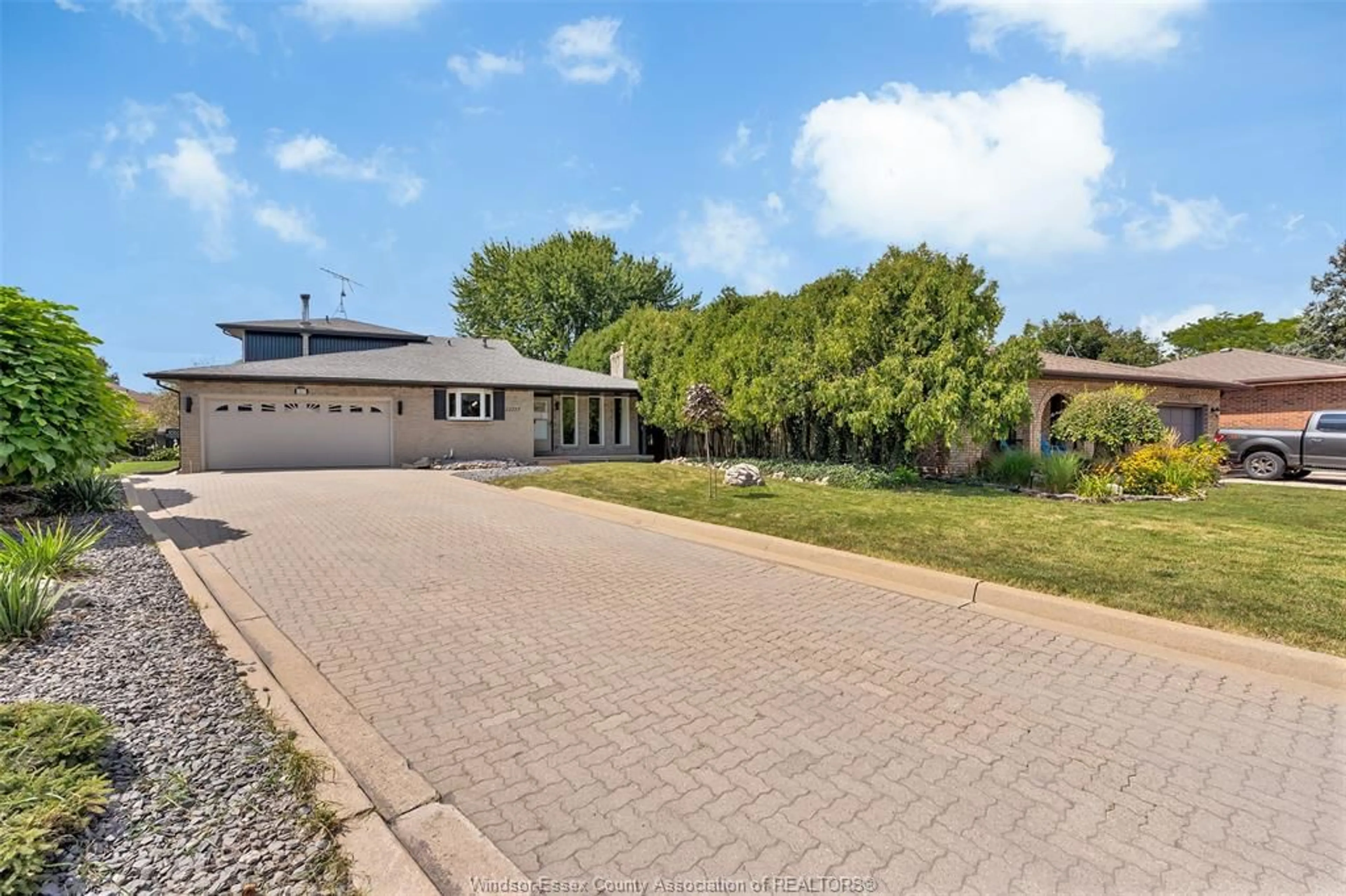 A pic from outside/outdoor area/front of a property/back of a property/a pic from drone, street for 12117 VALENTE Crt, Tecumseh Ontario N8N 3B9