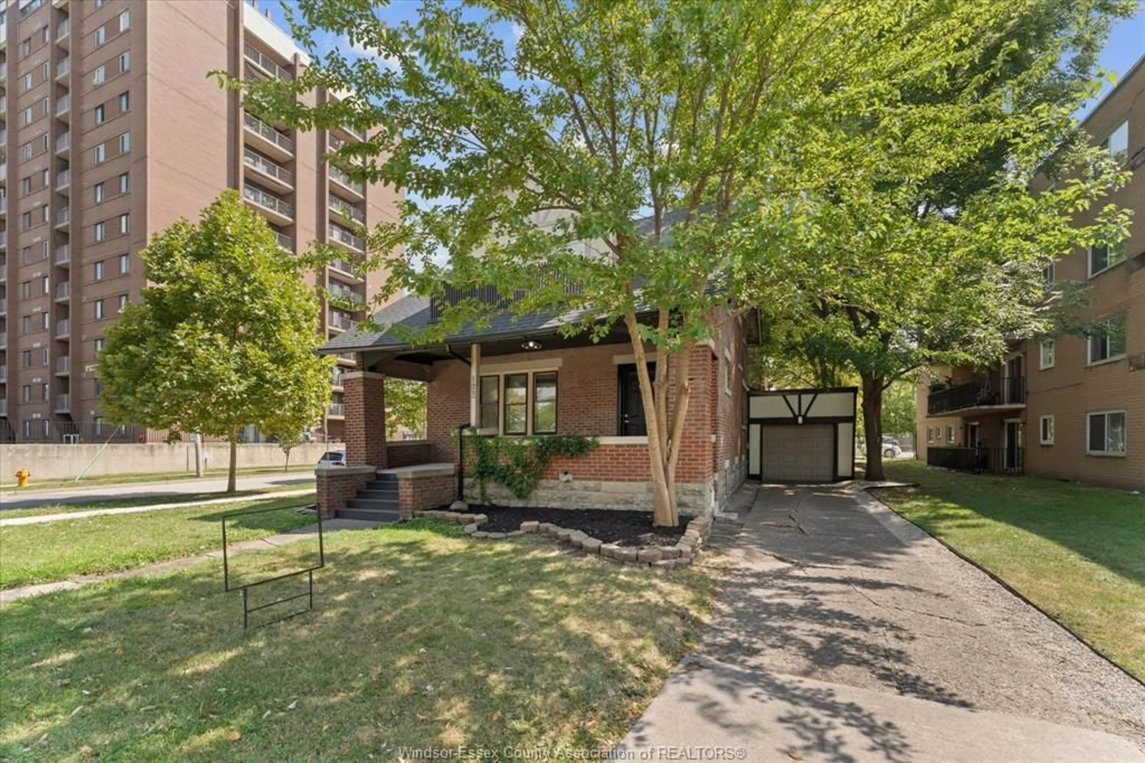 Home with brick exterior material, street for 1423 RIVERSIDE Dr, Windsor Ontario N9B 1A2