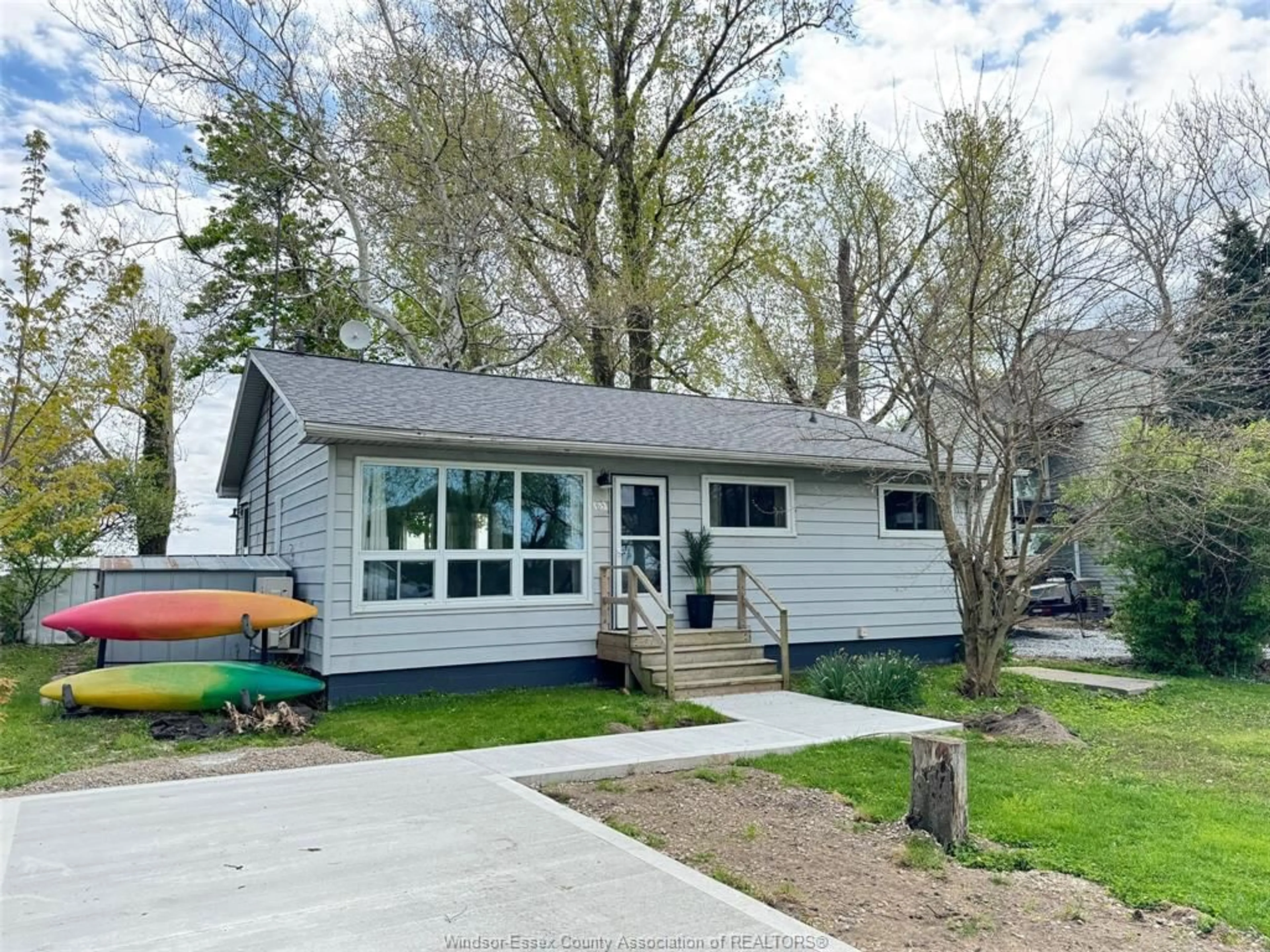 Home with vinyl exterior material, street for 83 Marentette Beach Dr, Leamington Ontario N8H 3V7