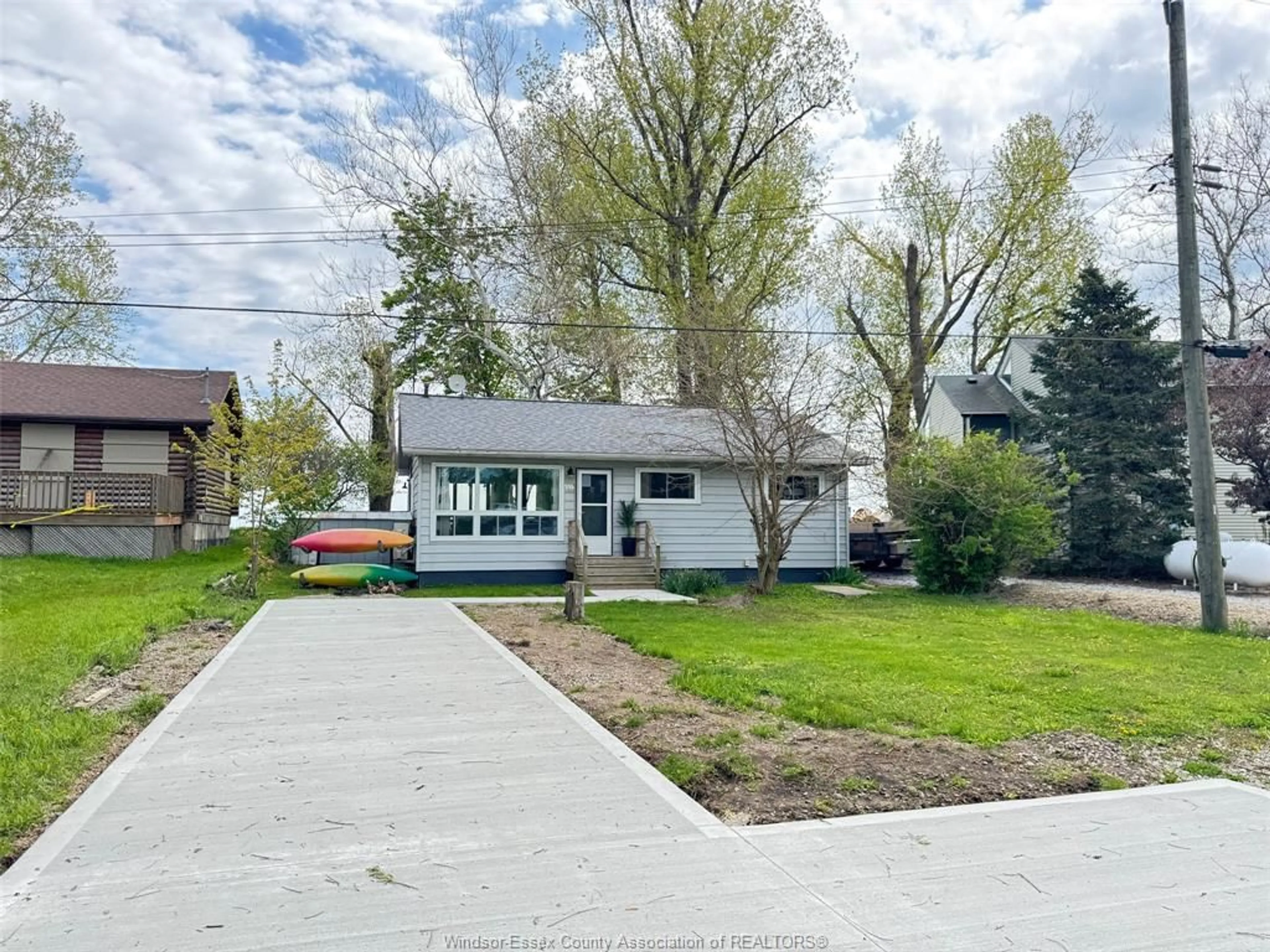 A pic from outside/outdoor area/front of a property/back of a property/a pic from drone, street for 83 Marentette Beach Dr, Leamington Ontario N8H 3V7