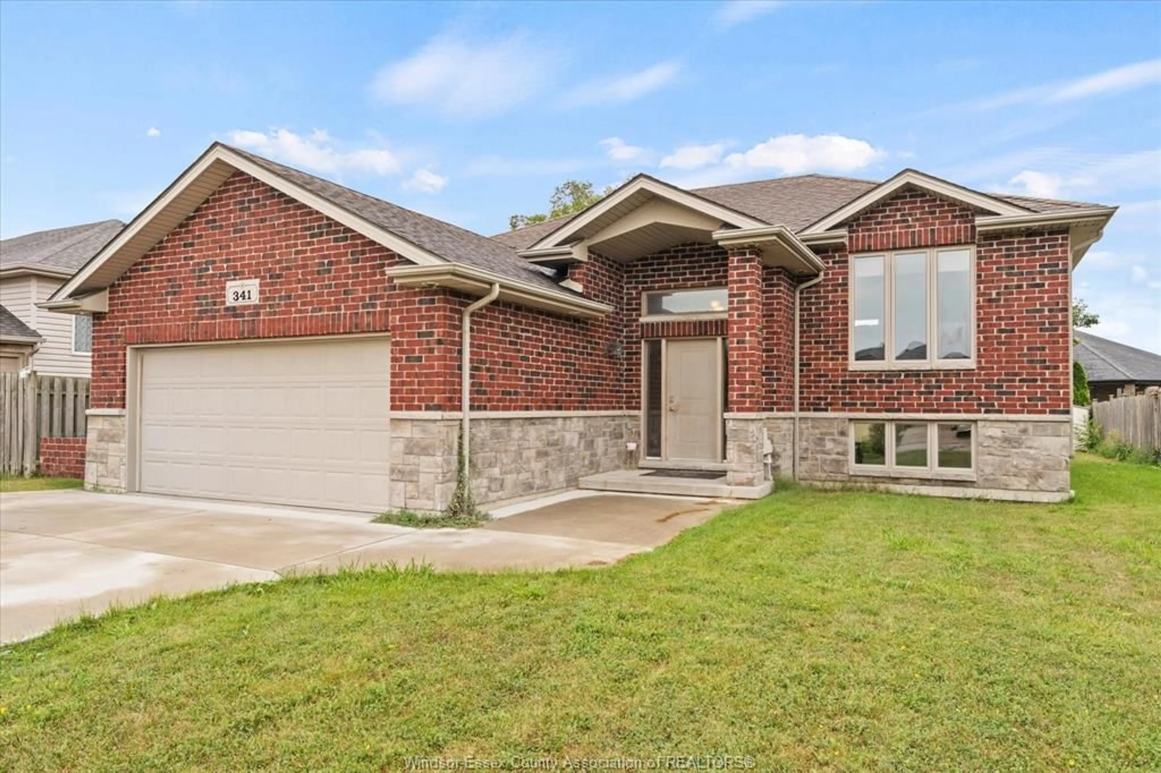Home with brick exterior material, street for 341 PIROLI Cres, Lakeshore Ontario N0R 1A0