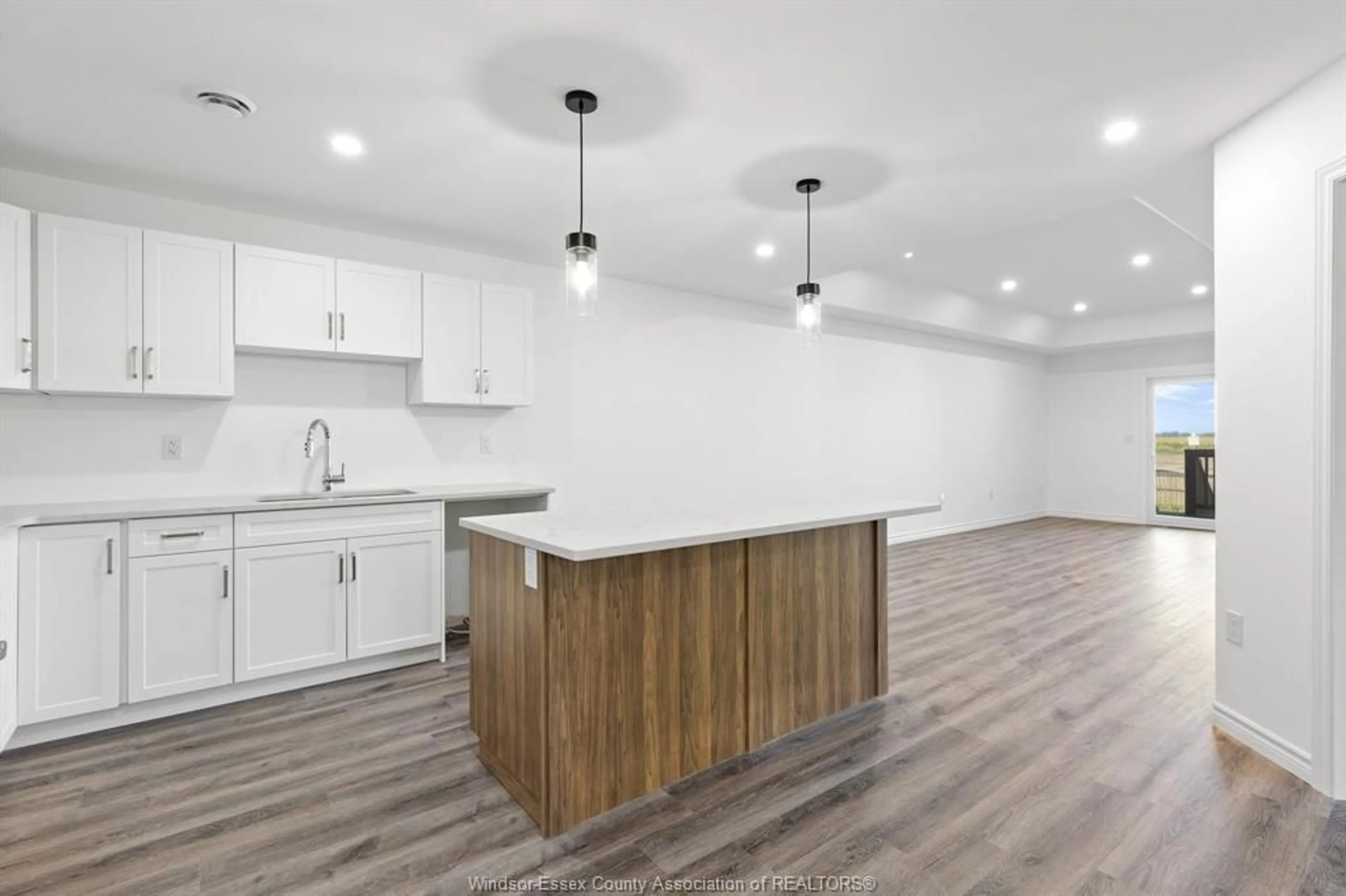 Open concept kitchen, wood/laminate floor for 100 ERIE St, Ridgetown Ontario N0P 2C0