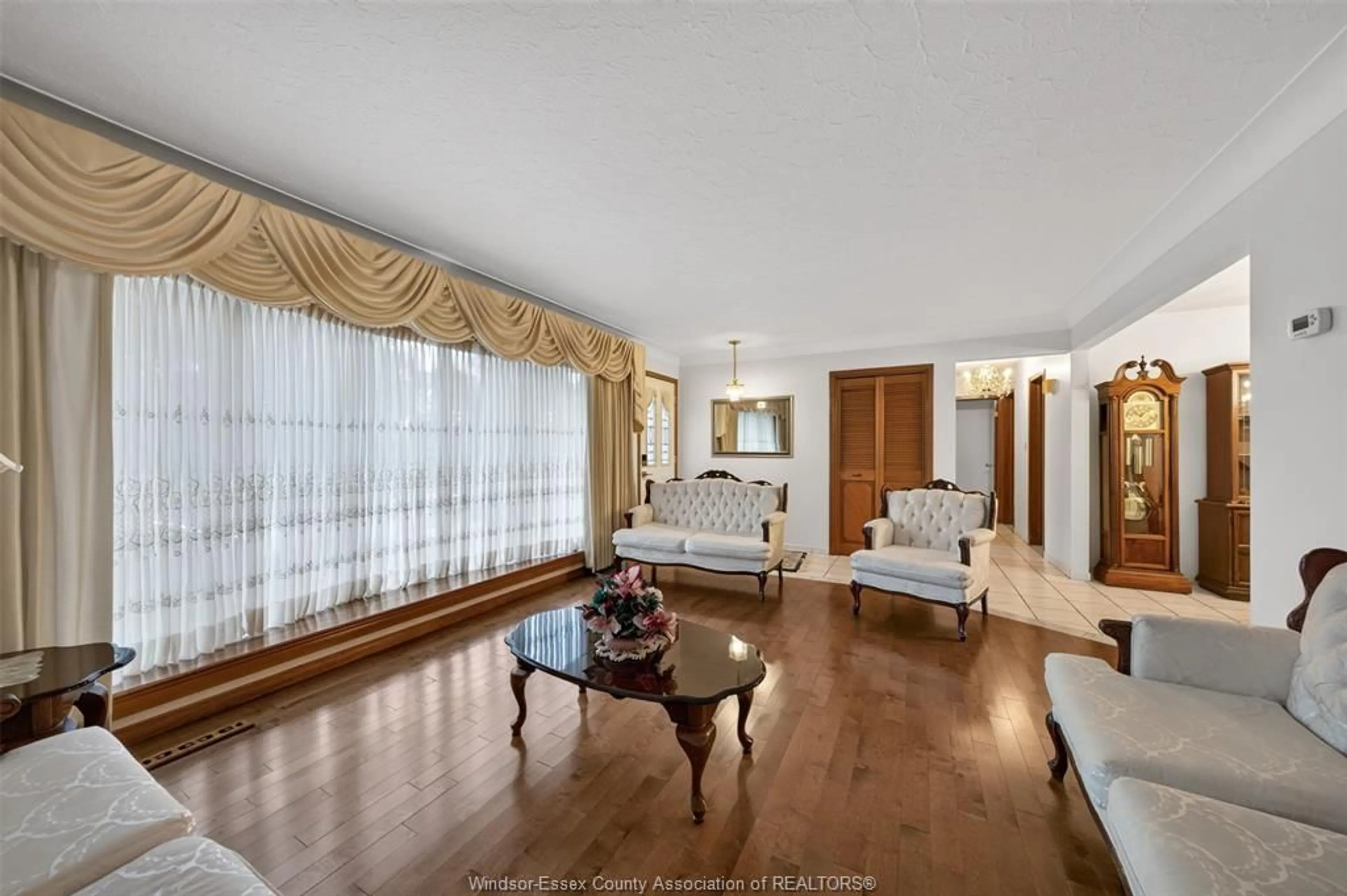 Living room with furniture, wood/laminate floor for 39 JOHNSON Ave, Leamington Ontario N8H 3T8
