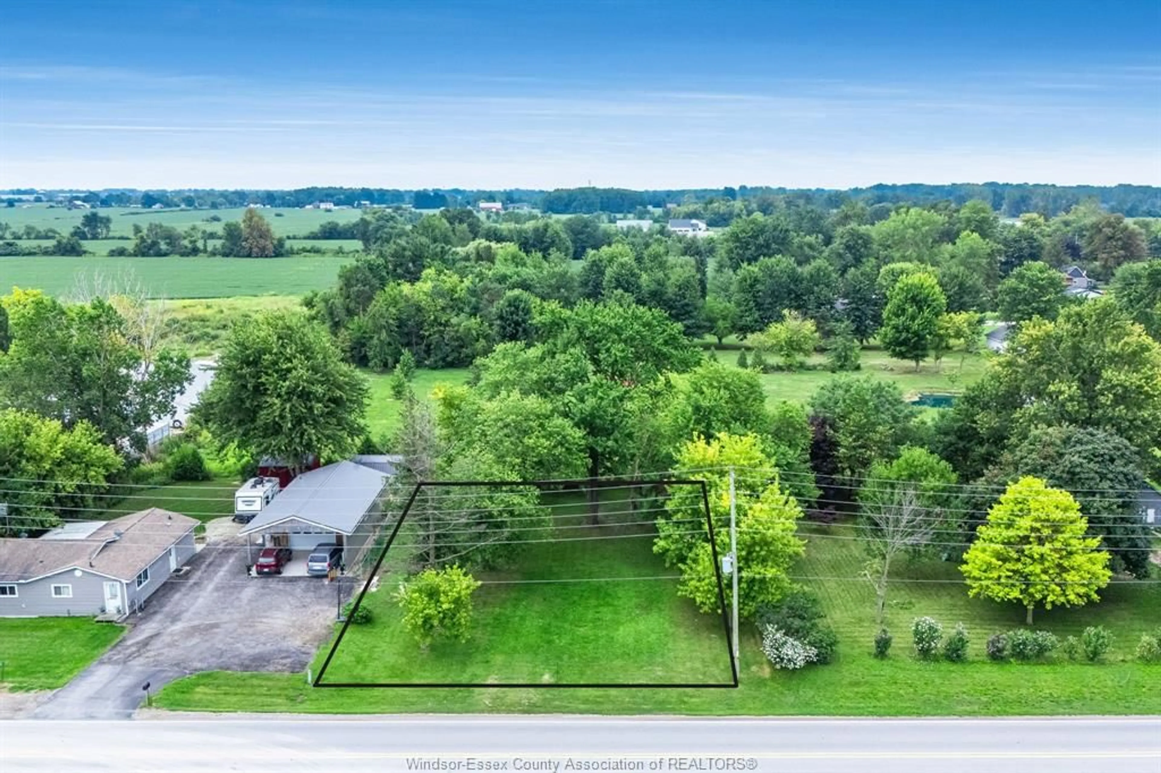 A pic from outside/outdoor area/front of a property/back of a property/a pic from drone, water/lake/river/ocean view for 99 Road 4, Kingsville Ontario N9Y 2E5