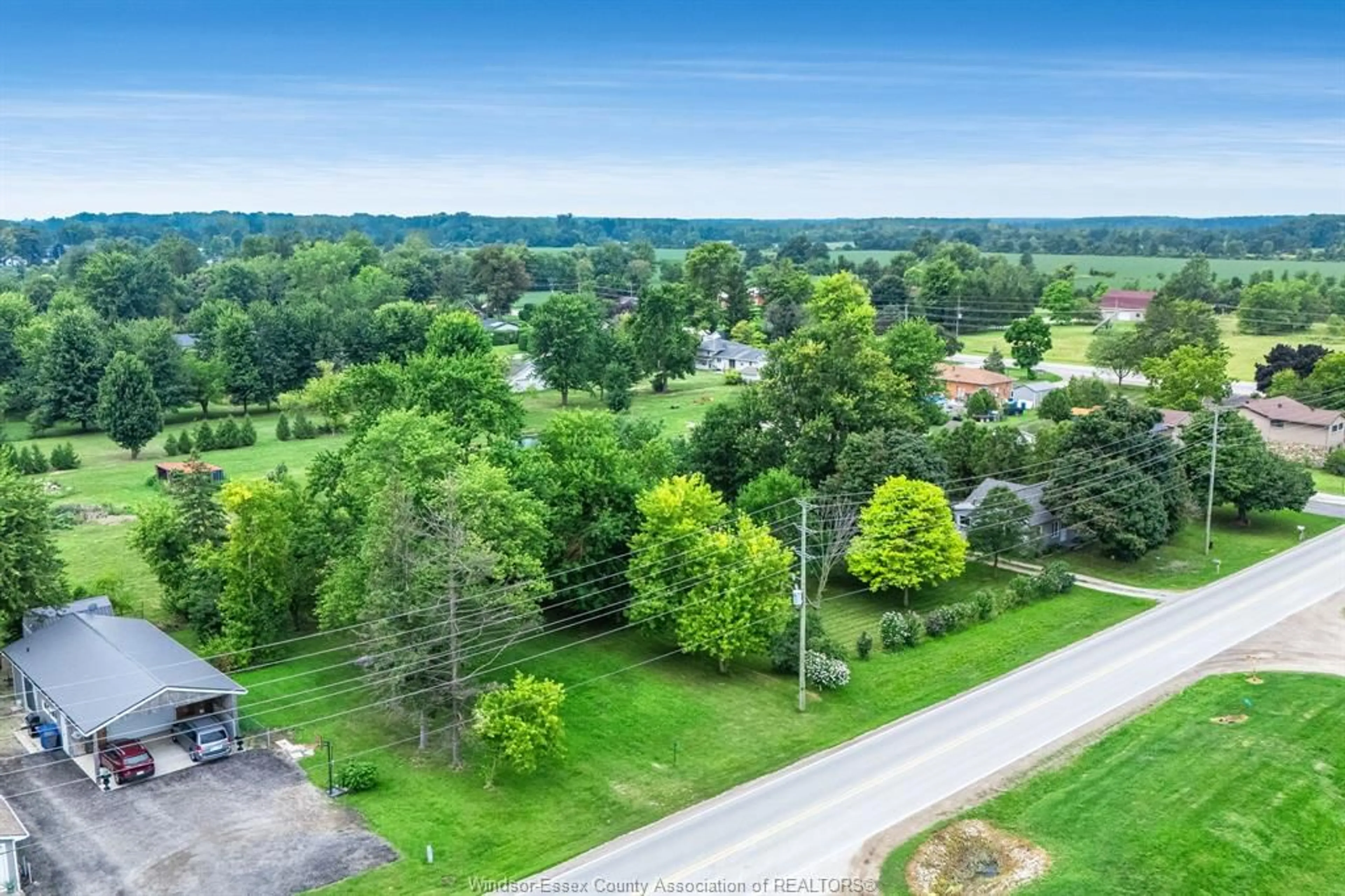 A pic from outside/outdoor area/front of a property/back of a property/a pic from drone, forest/trees view for 99 Road 4, Kingsville Ontario N9Y 2E5