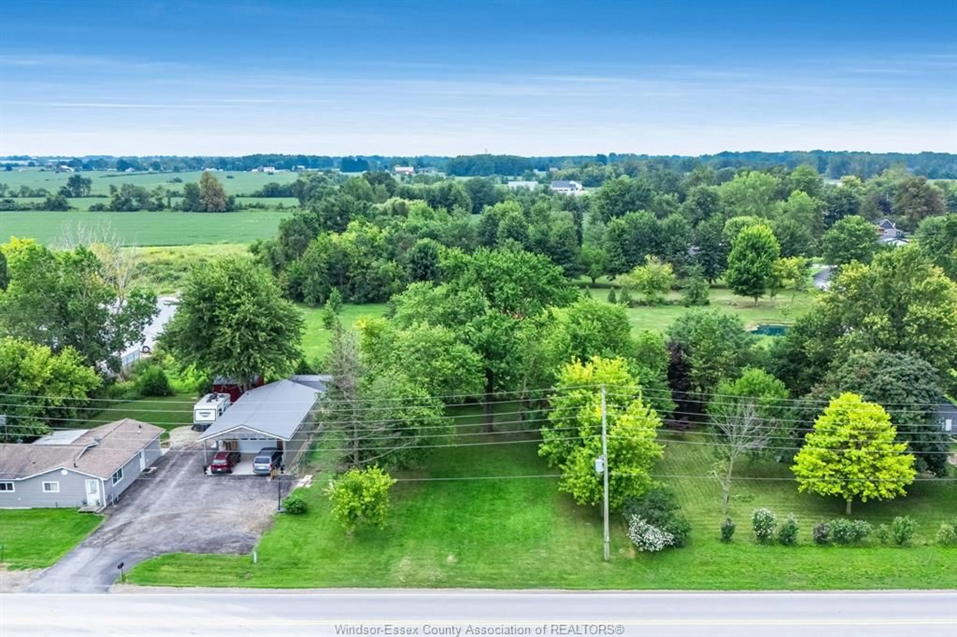 A pic from outside/outdoor area/front of a property/back of a property/a pic from drone, unknown for 99 Road 4, Kingsville Ontario N9Y 2E5