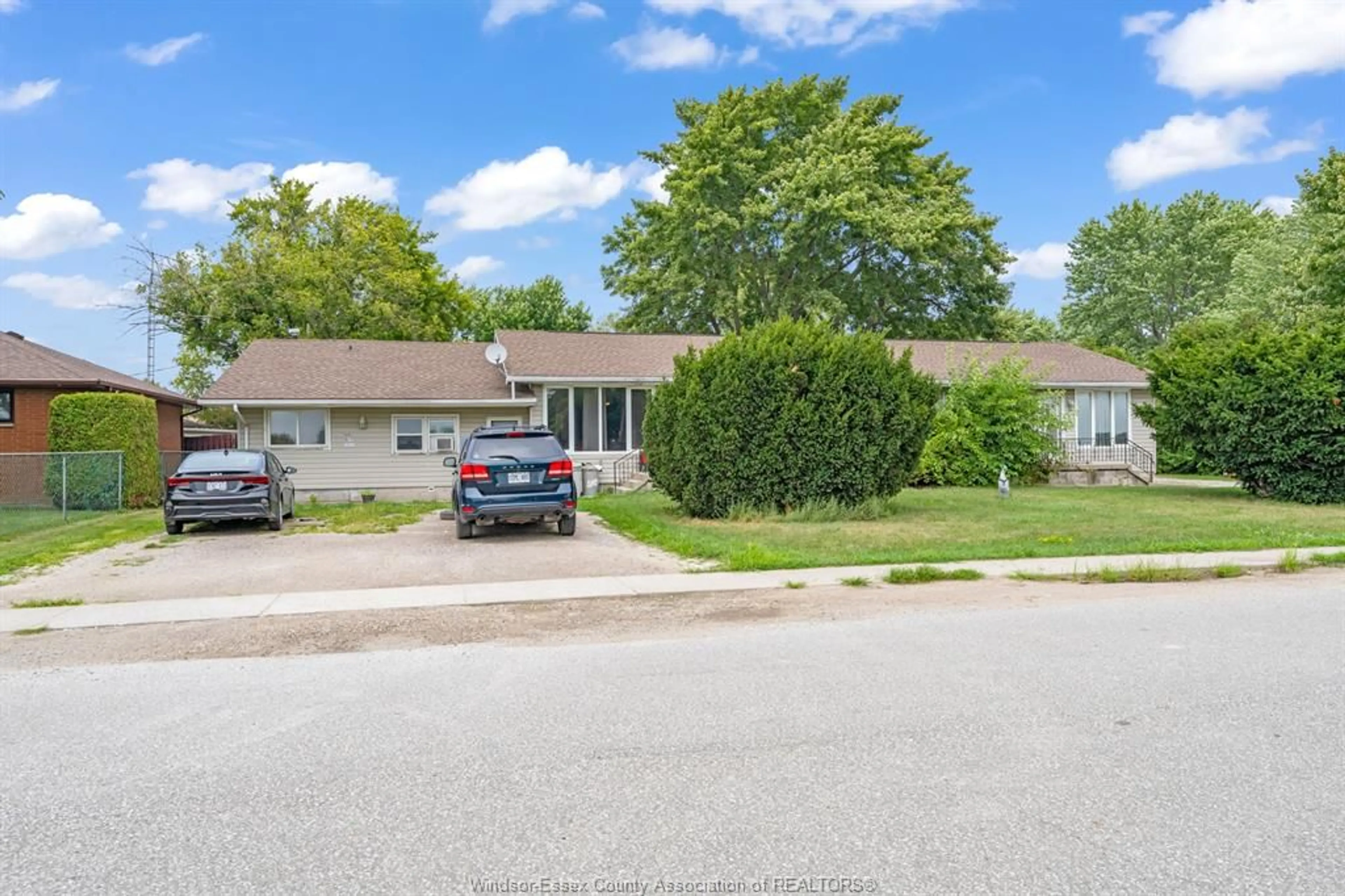 A pic from outside/outdoor area/front of a property/back of a property/a pic from drone, street for 1228 FAITH Dr, Lakeshore Ontario N0R 1C0