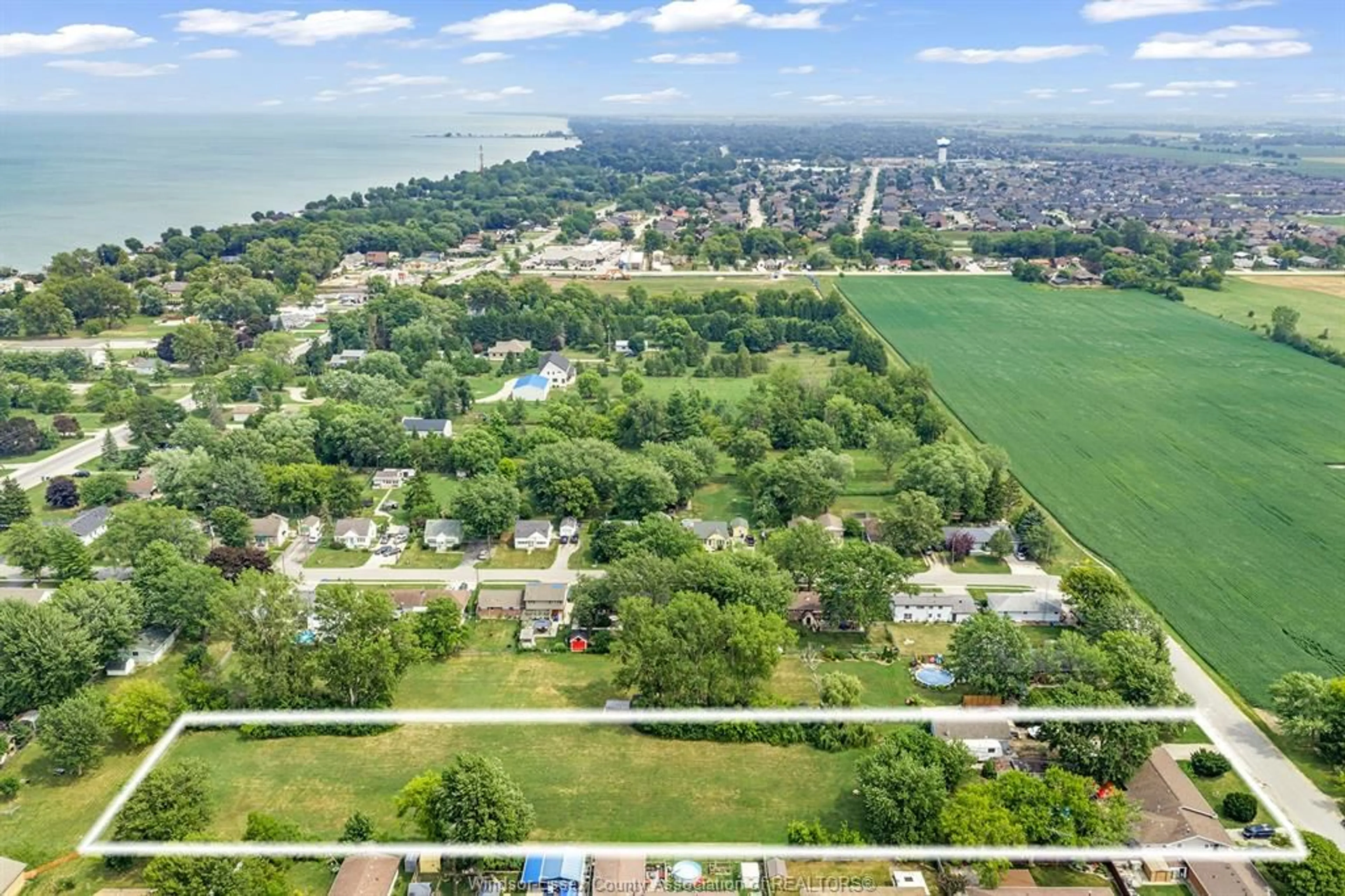 A pic from outside/outdoor area/front of a property/back of a property/a pic from drone, water/lake/river/ocean view for 1228 FAITH Dr, Lakeshore Ontario N0R 1C0