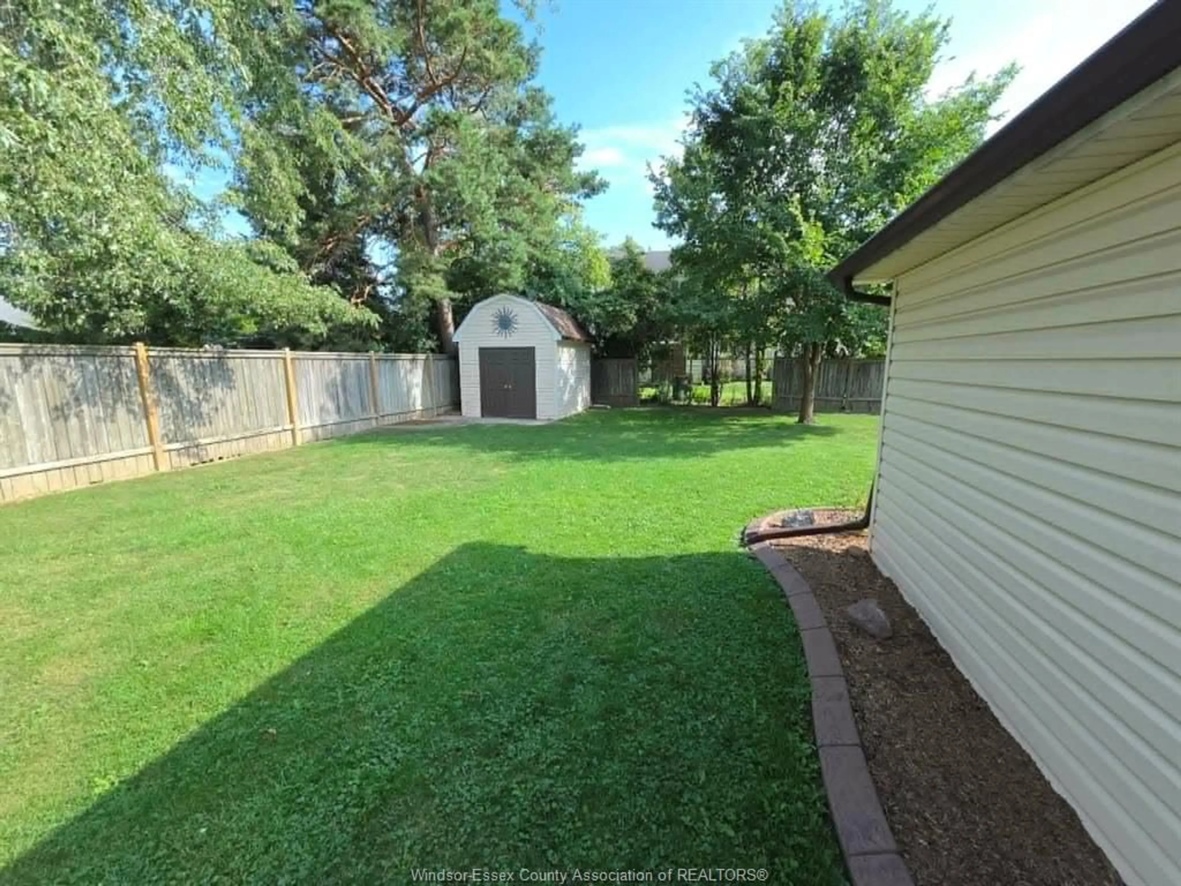 A pic from outside/outdoor area/front of a property/back of a property/a pic from drone, water/lake/river/ocean view for 12441 RENAUD St, Tecumseh Ontario N8N 1P5