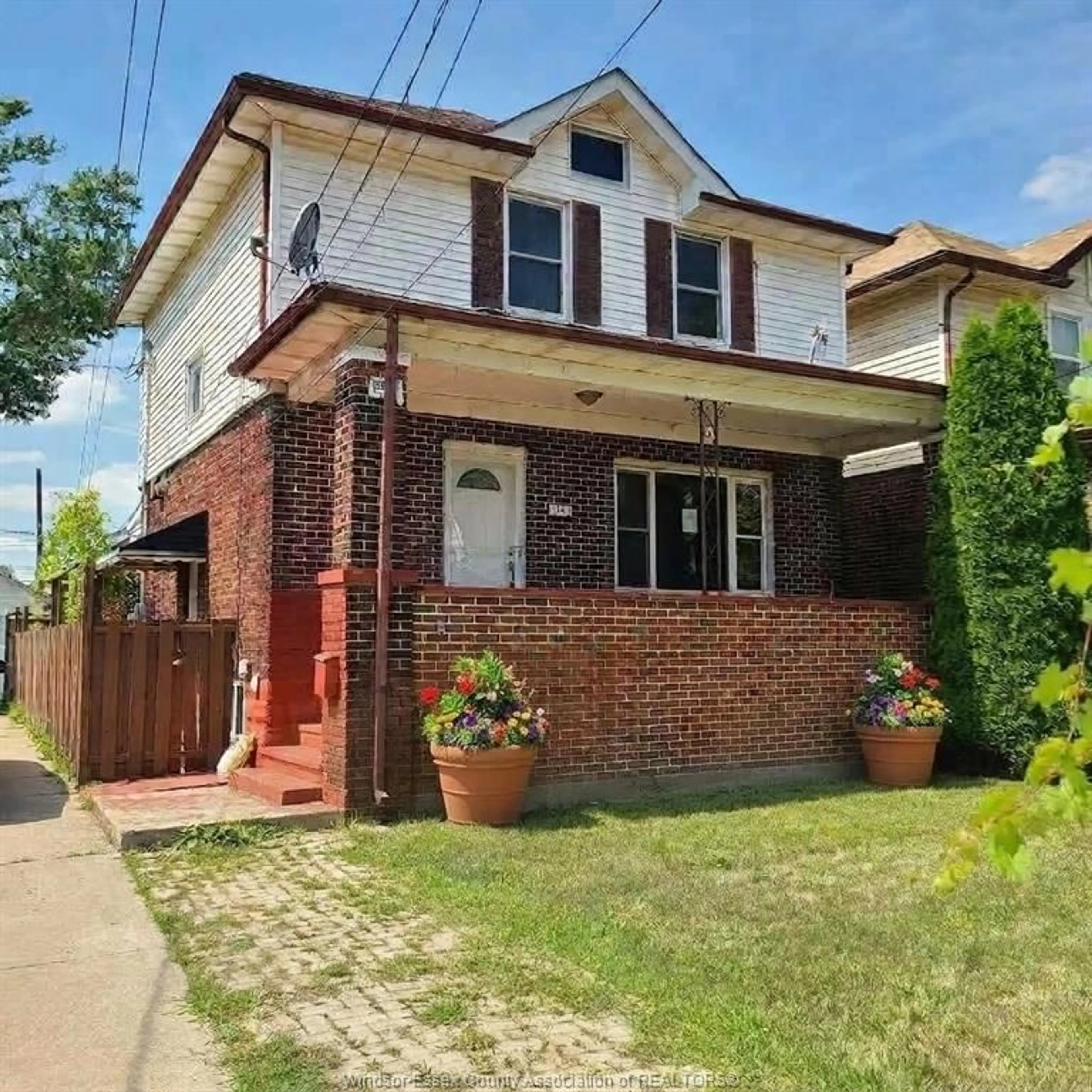 Home with brick exterior material, street for 1165 Elm Ave, Windsor Ontario N9A 5J1