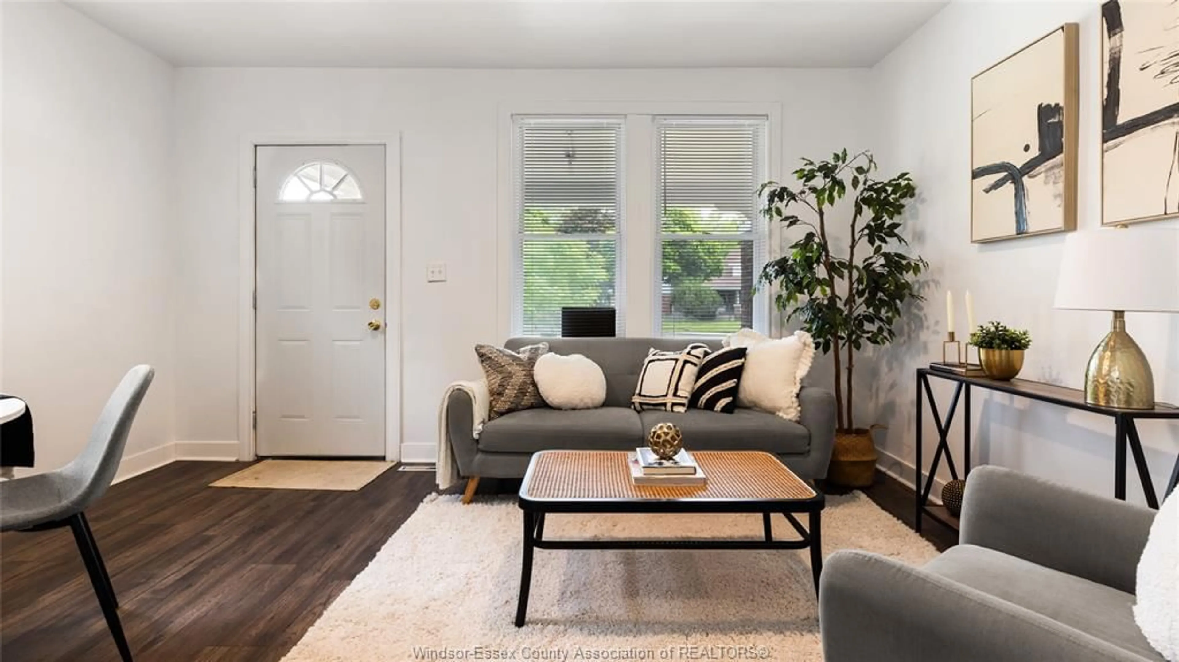 Living room with furniture, wood/laminate floor for 737 Piche, Windsor Ontario N9C 3G6