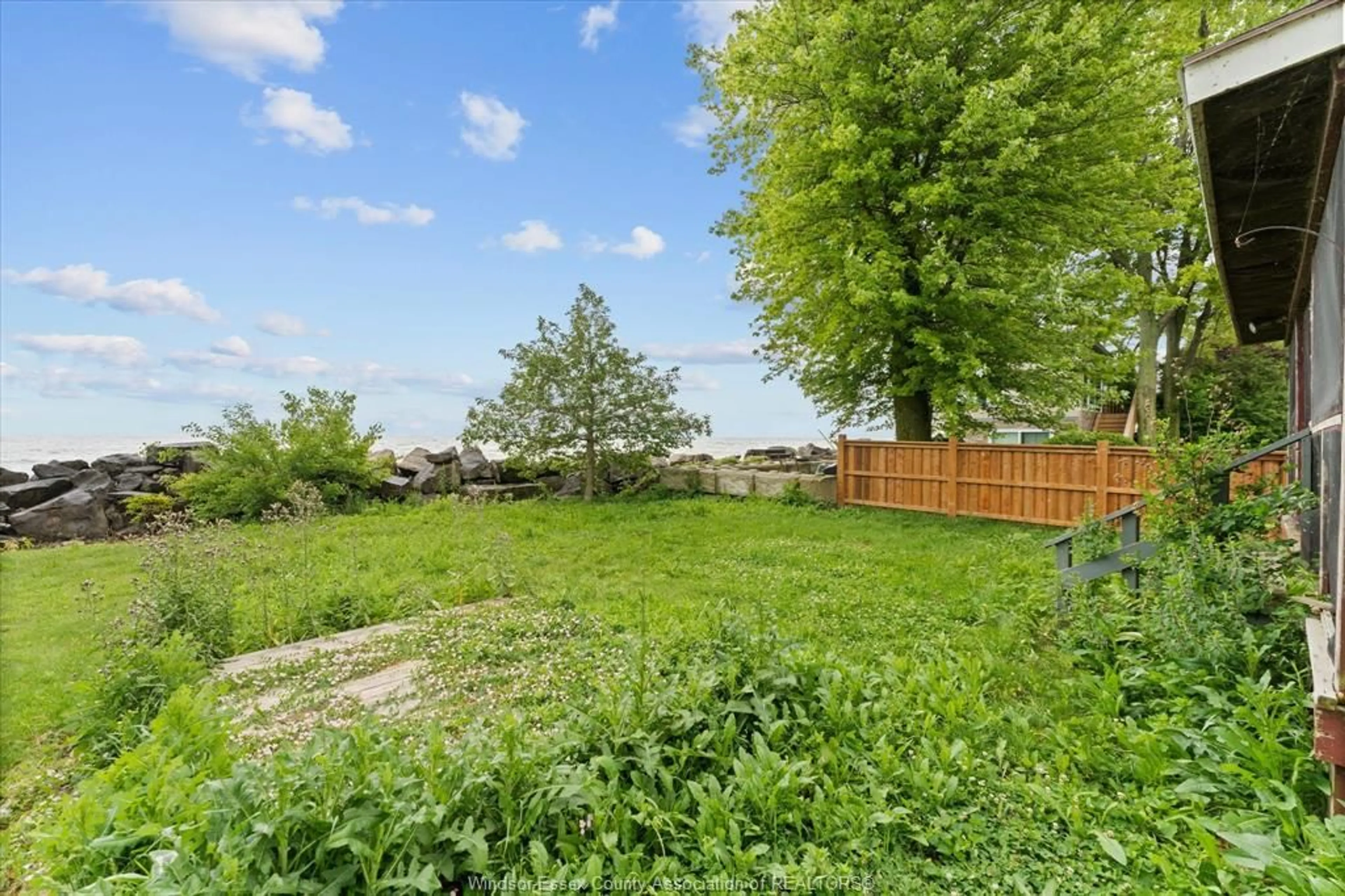 A pic from outside/outdoor area/front of a property/back of a property/a pic from drone, forest/trees view for 390 EAST BEACH, Leamington Ontario N9H 3V7