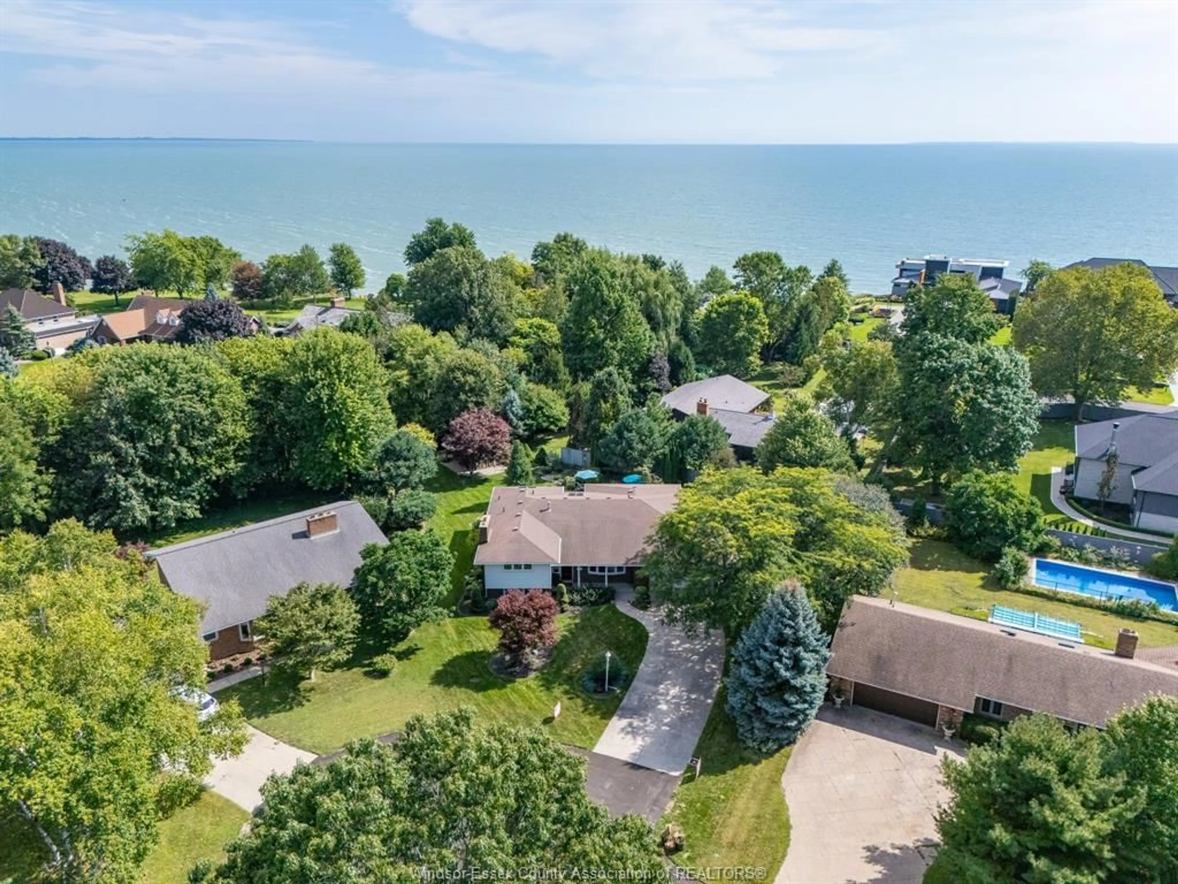 A pic from outside/outdoor area/front of a property/back of a property/a pic from drone, water/lake/river/ocean view for 1502 Bayfield Cres, Kingsville Ontario N9Y 2X7