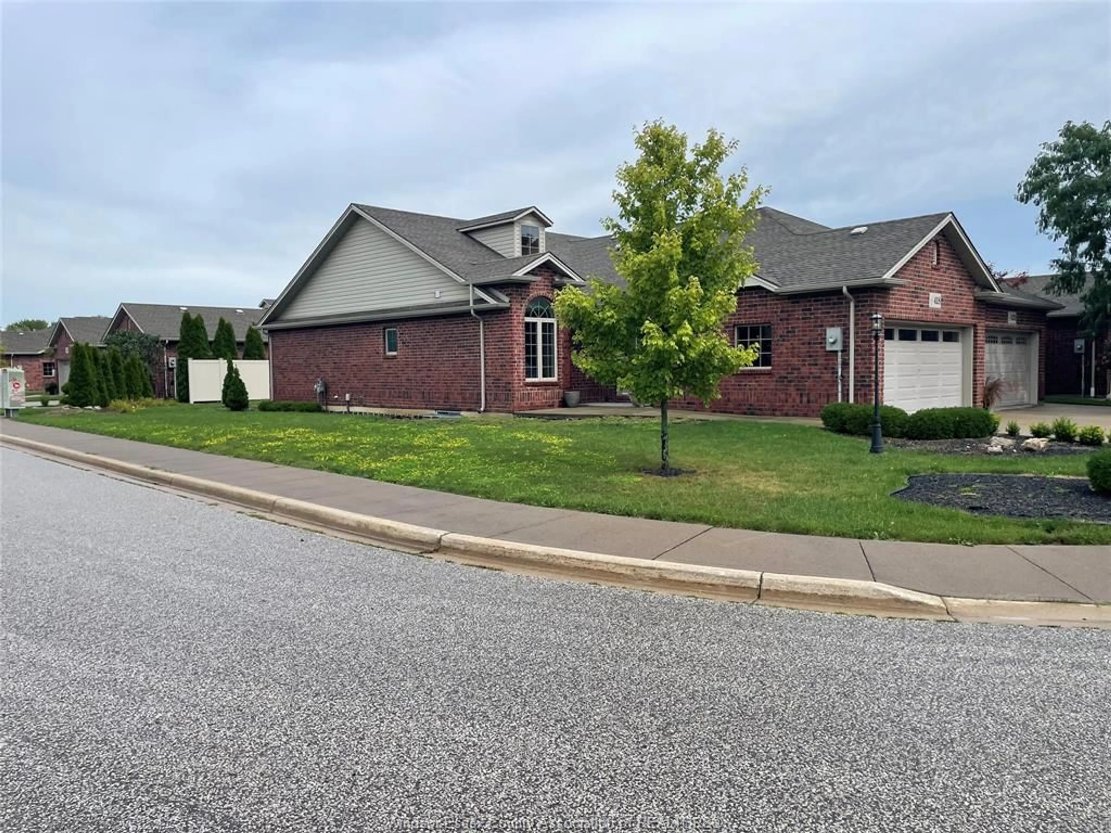 Home with brick exterior material, street for 418 COOPER Cres, Lakeshore Ontario N0R 1A0