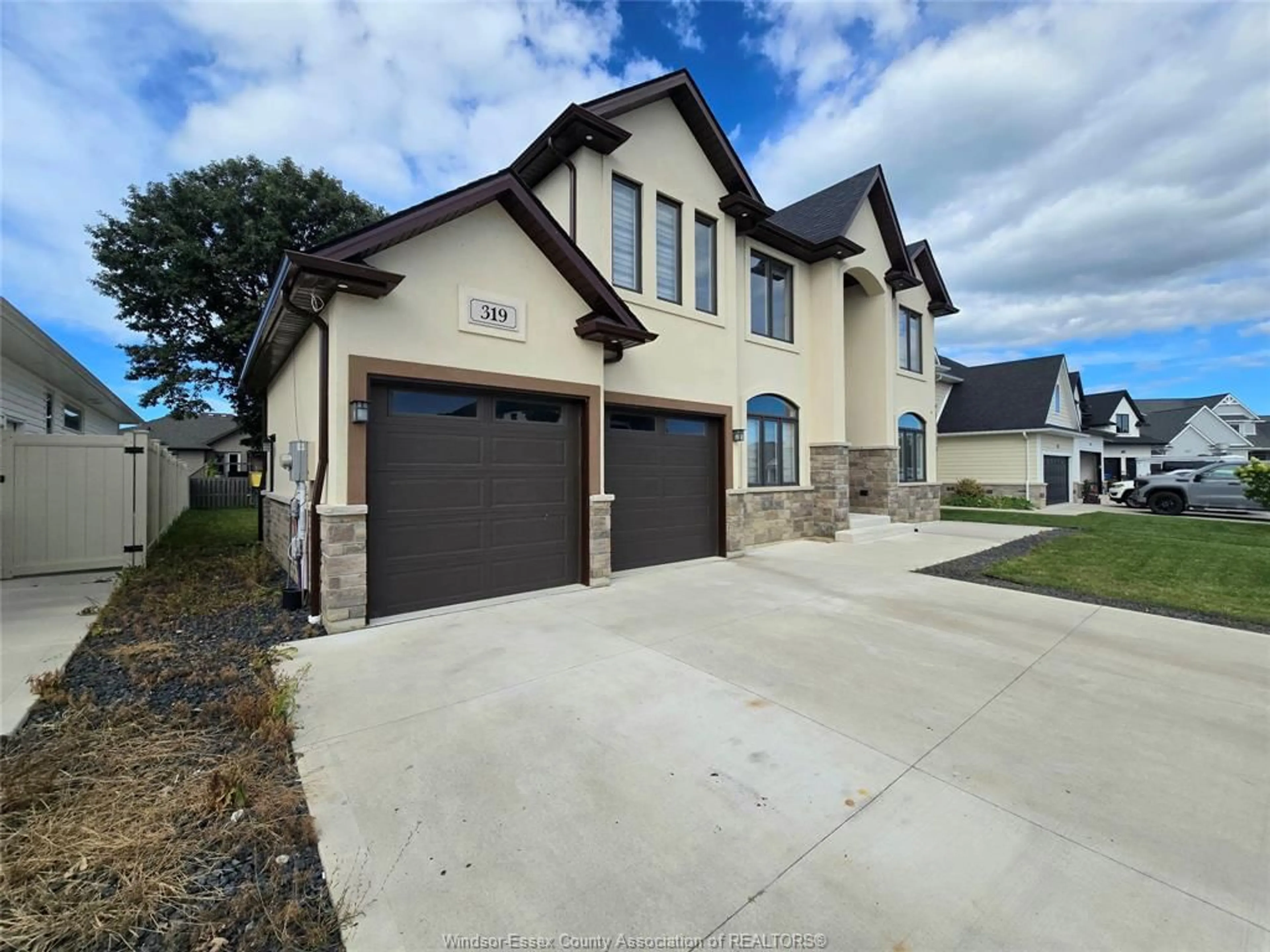 Home with brick exterior material, street for 319 CHRISTINE Ave, Belle River Ontario N8L 1B5