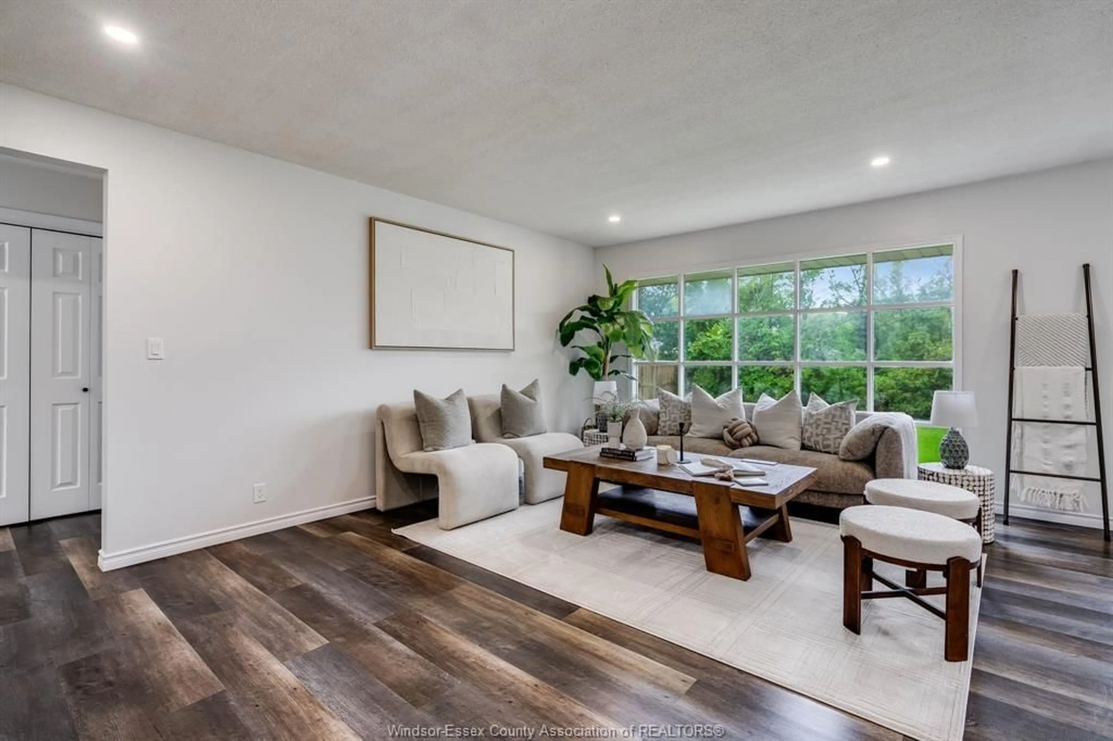 Living room with furniture, wood/laminate floor for 84 Palmer Dr, Kingsville Ontario N9Y 3B4
