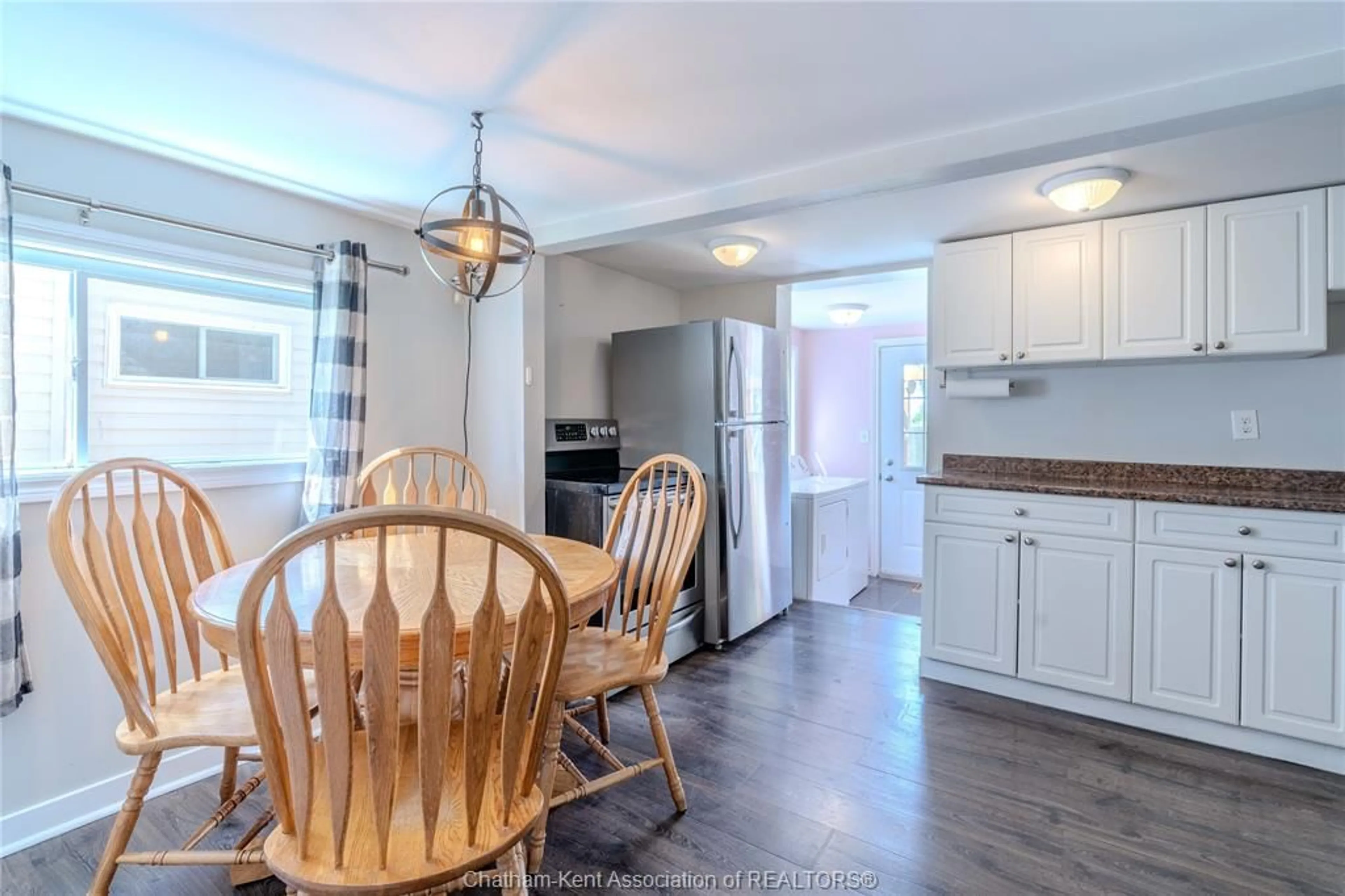 Open concept kitchen, wood/laminate floor for 32 Degge St, Chatham Ontario N7M 4X2