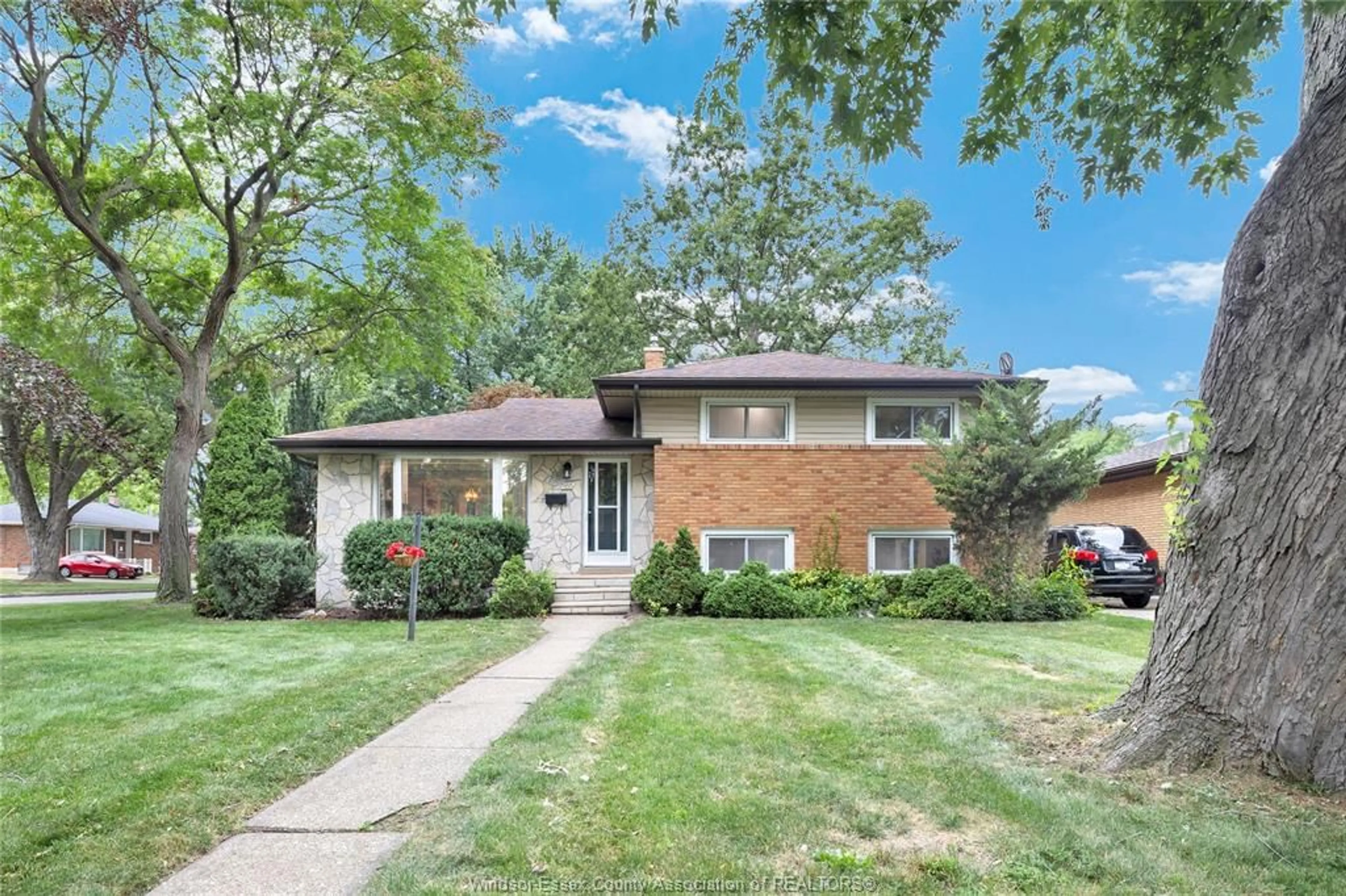Home with brick exterior material, street for 465 GREENDALE Dr, Windsor Ontario N8S 4A5