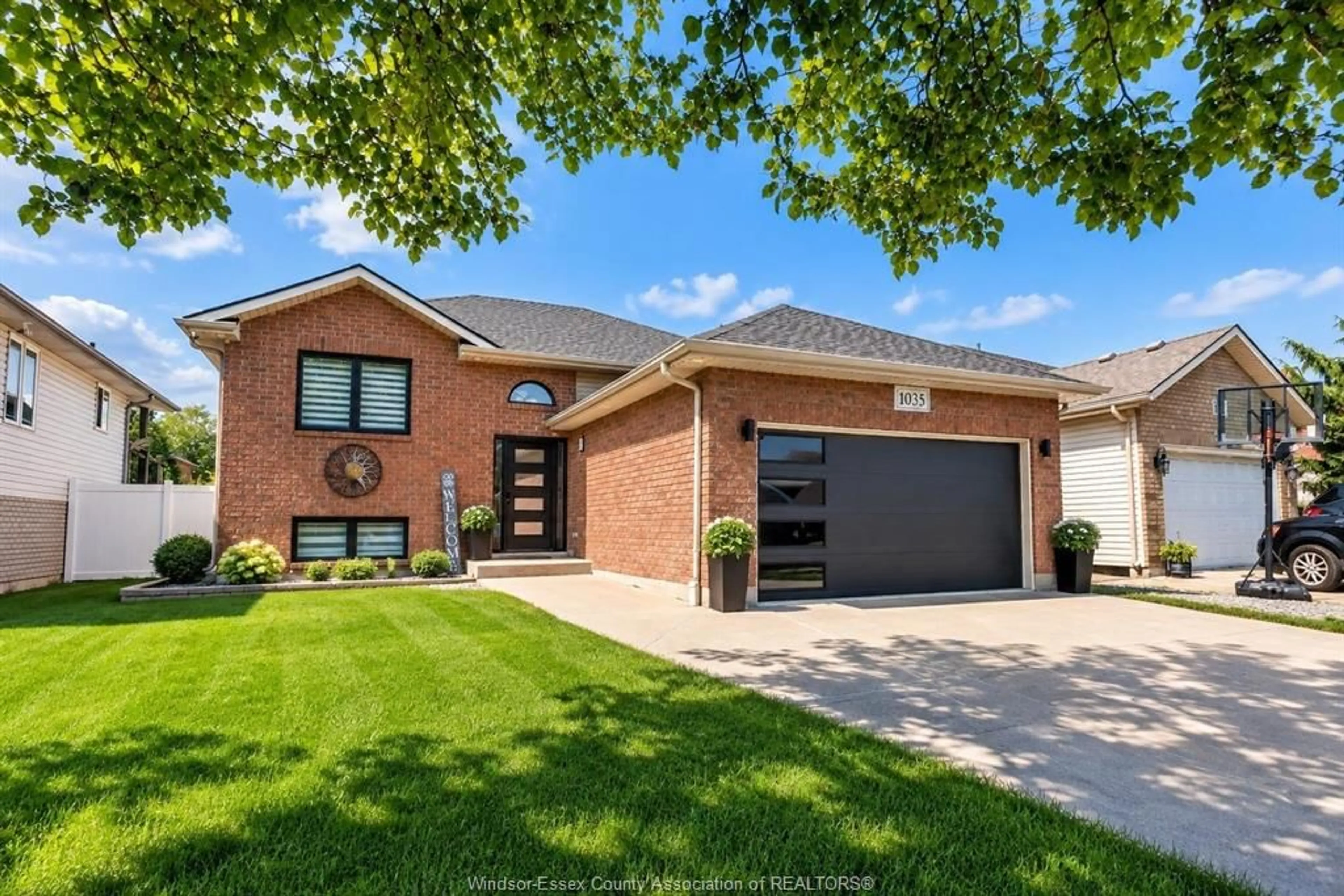 Home with brick exterior material, street for 1035 TREVERTON Cres, Windsor Ontario N8P 1K2