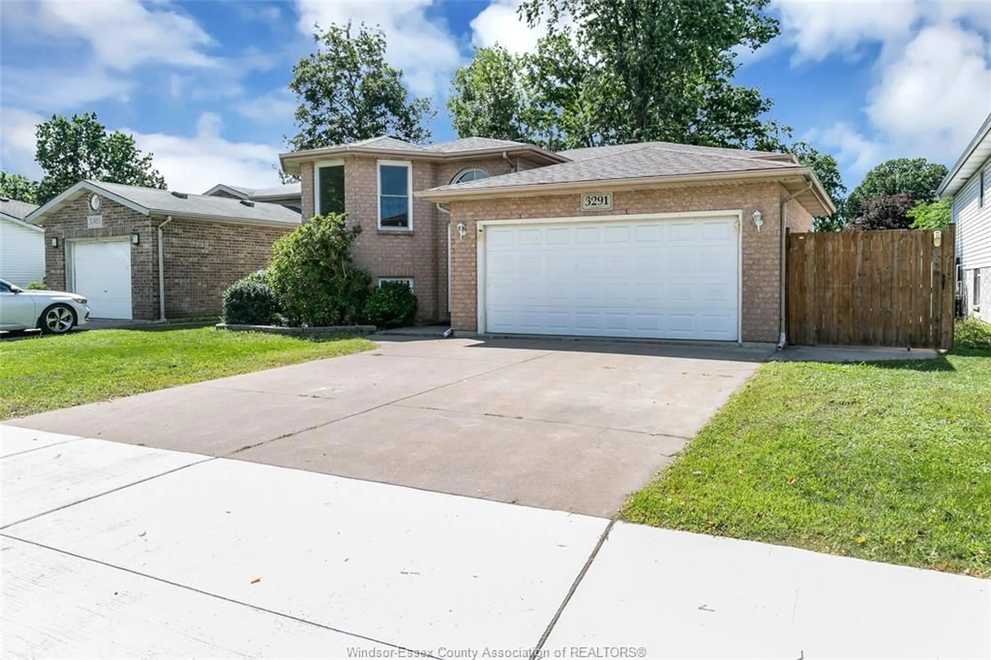Home with brick exterior material, street for 3291 CONSERVATION Dr, Windsor Ontario N8W 5P2