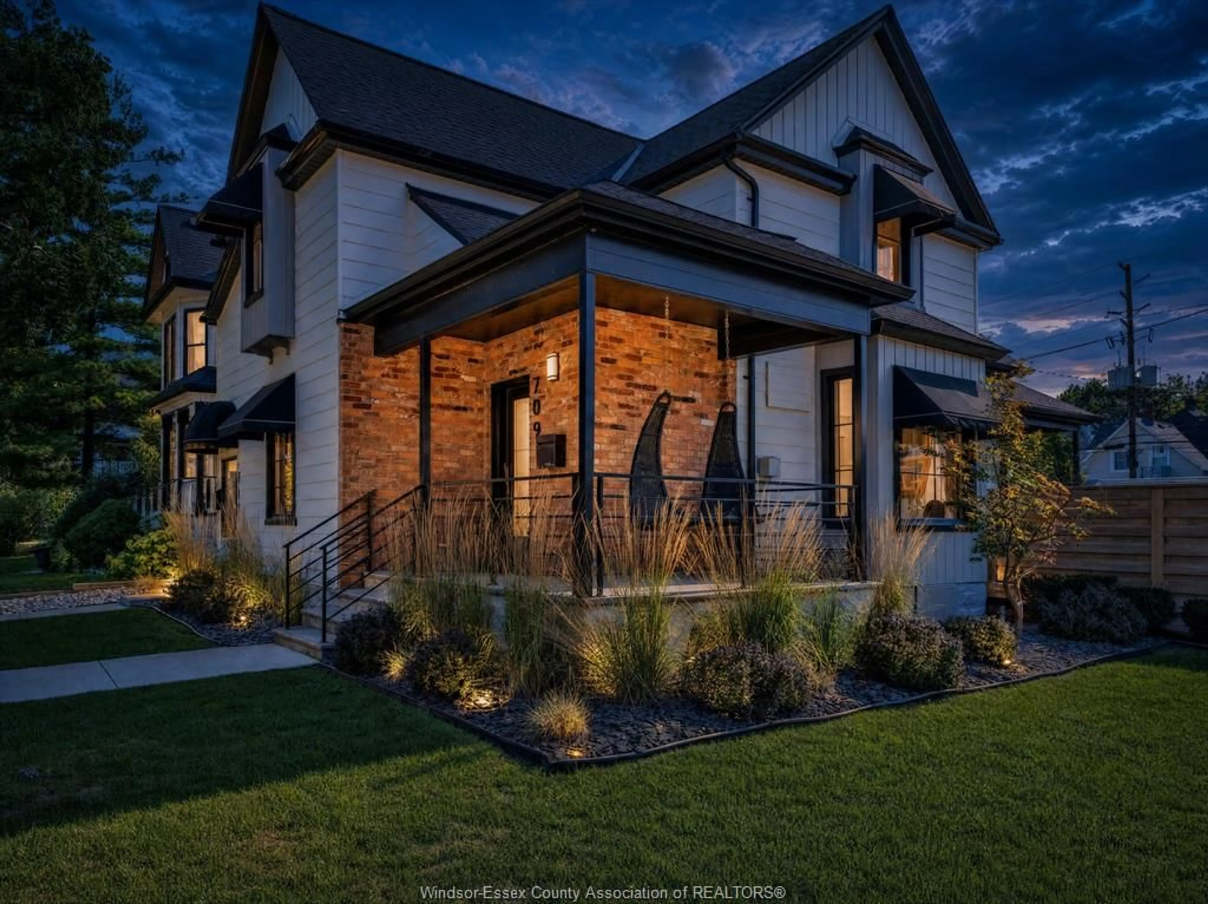 Home with brick exterior material, street for 709-711 KILDARE Rd, Windsor Ontario N8Y 3H1