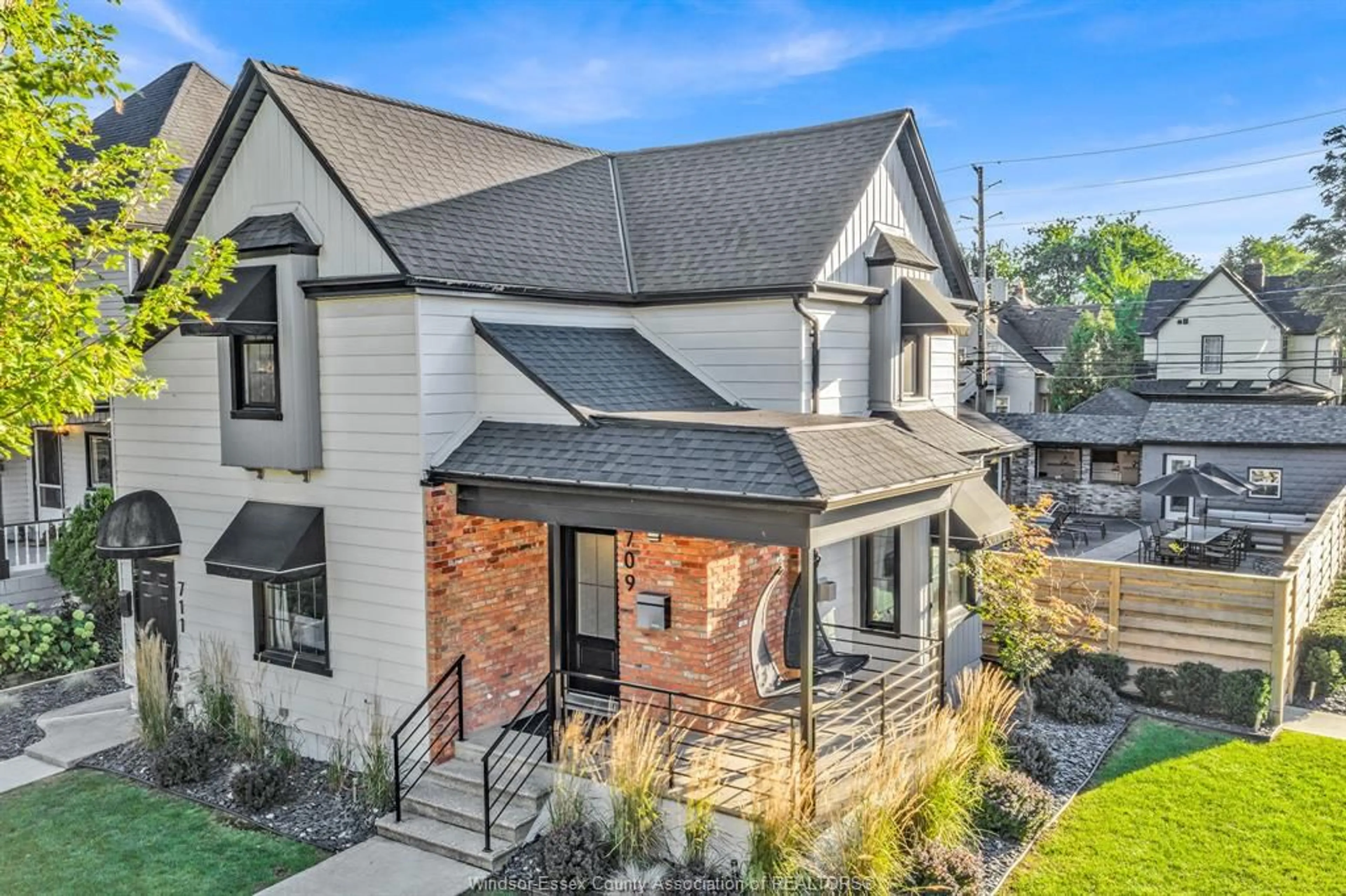 Home with brick exterior material, street for 709-711 KILDARE Rd, Windsor Ontario N8Y 3H1