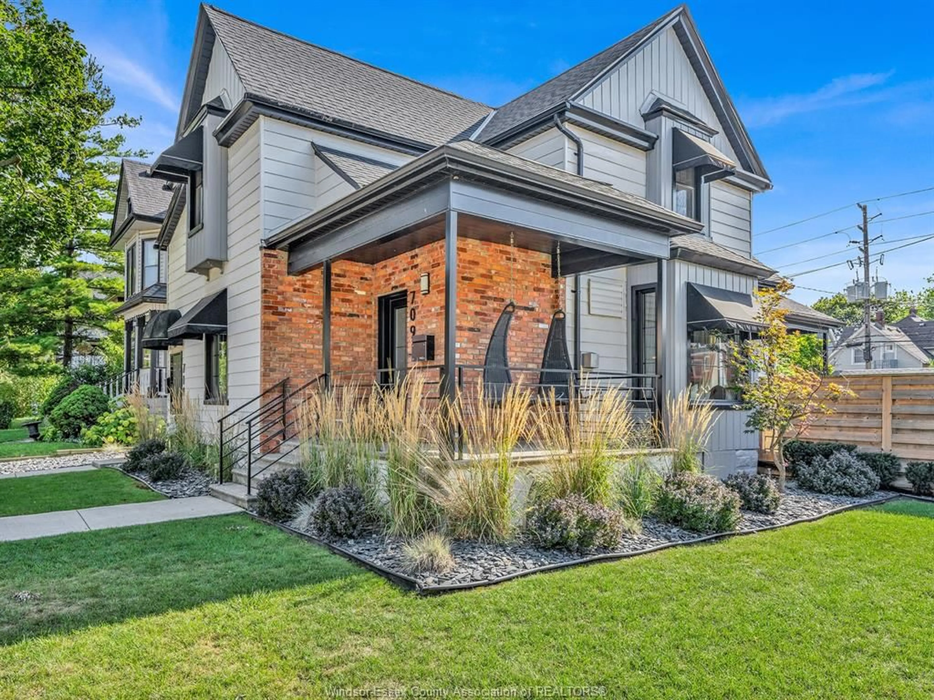 Home with brick exterior material, street for 709-711 KILDARE Rd, Windsor Ontario N8Y 3H1