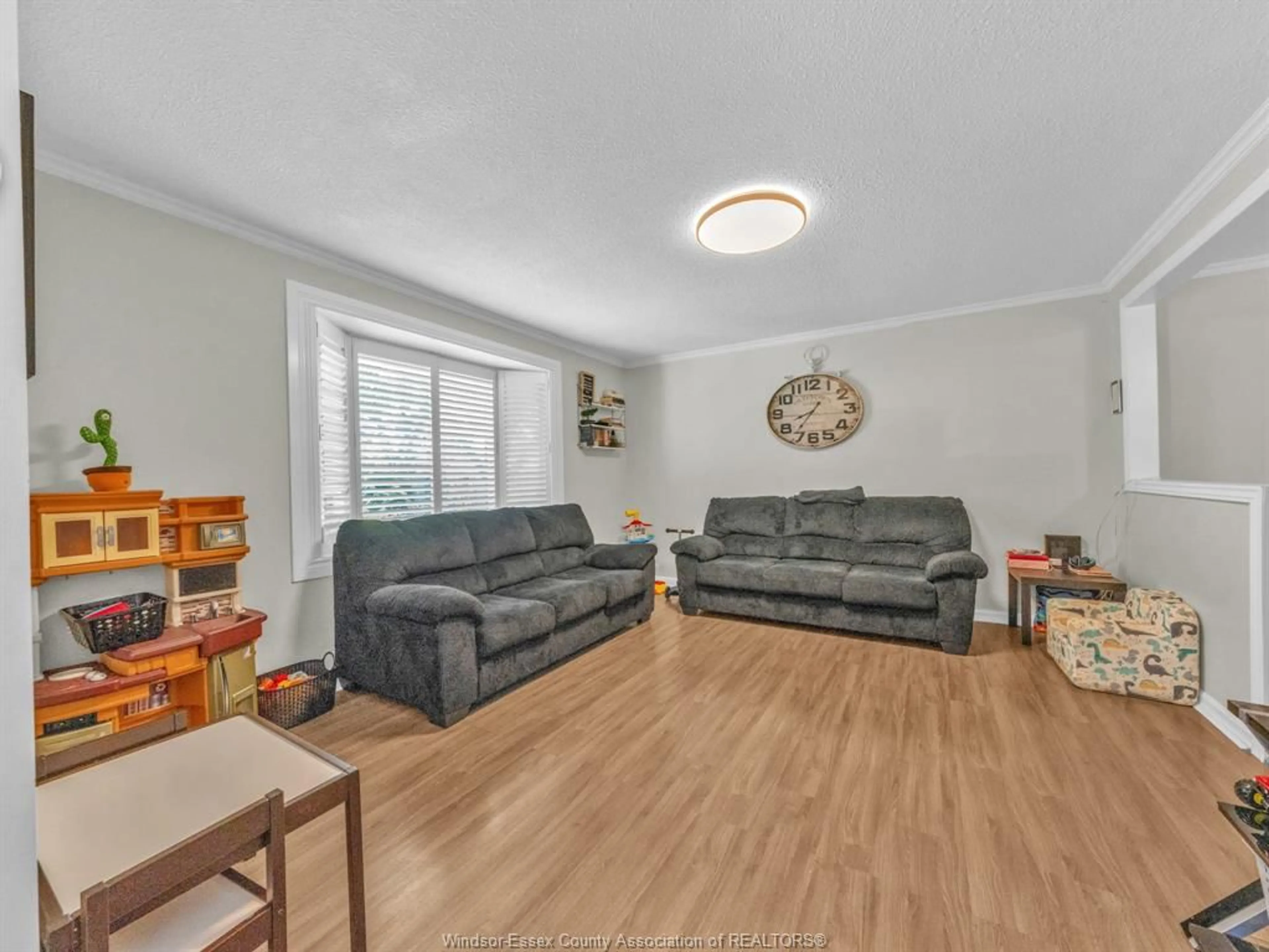 Living room with furniture, wood/laminate floor for 3149 ELMWOOD Cres, Windsor Ontario N8R 1X5