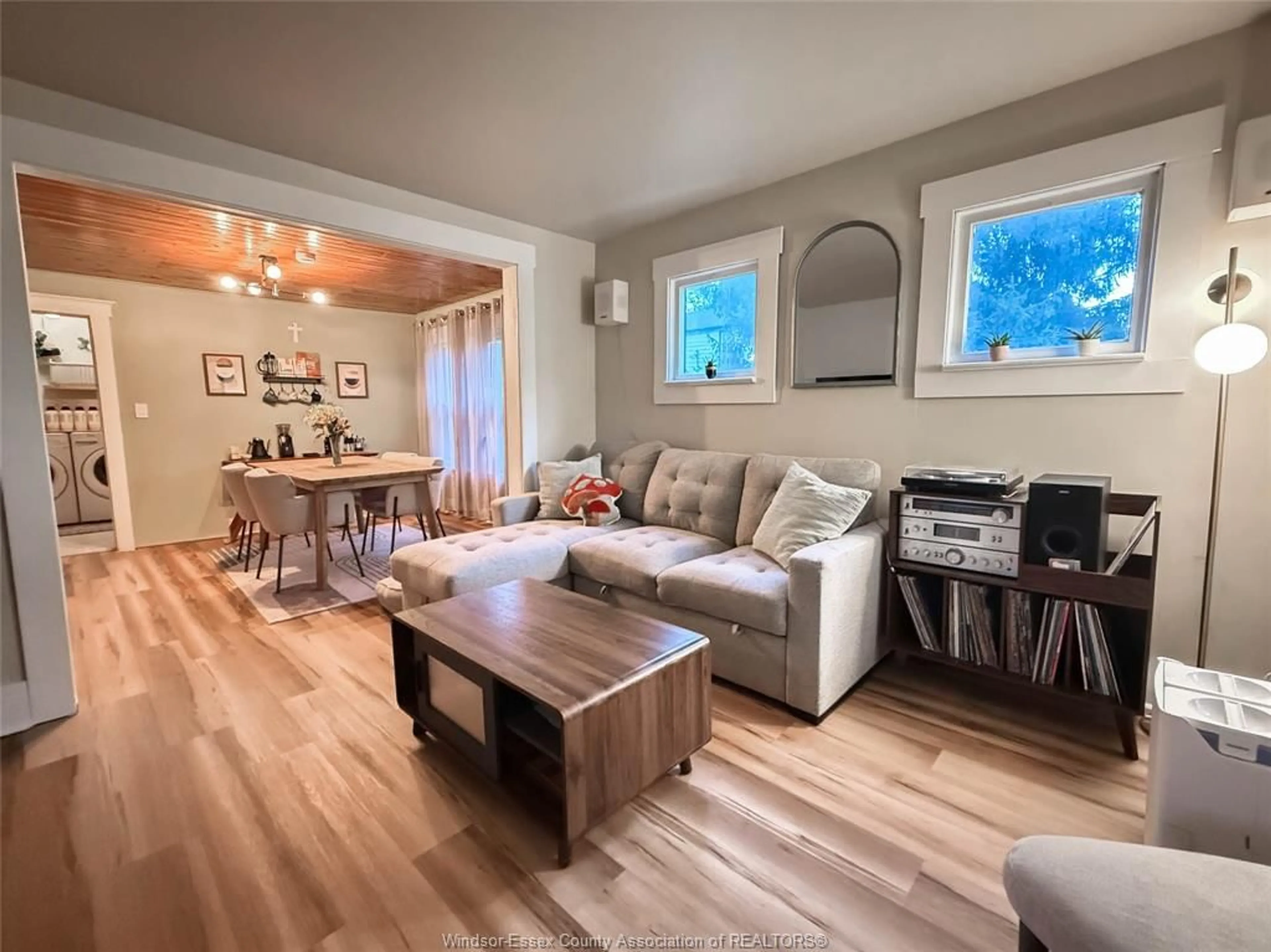 Living room with furniture, wood/laminate floor for 135 MAPLE Ave, LaSalle Ontario N9J 1N7