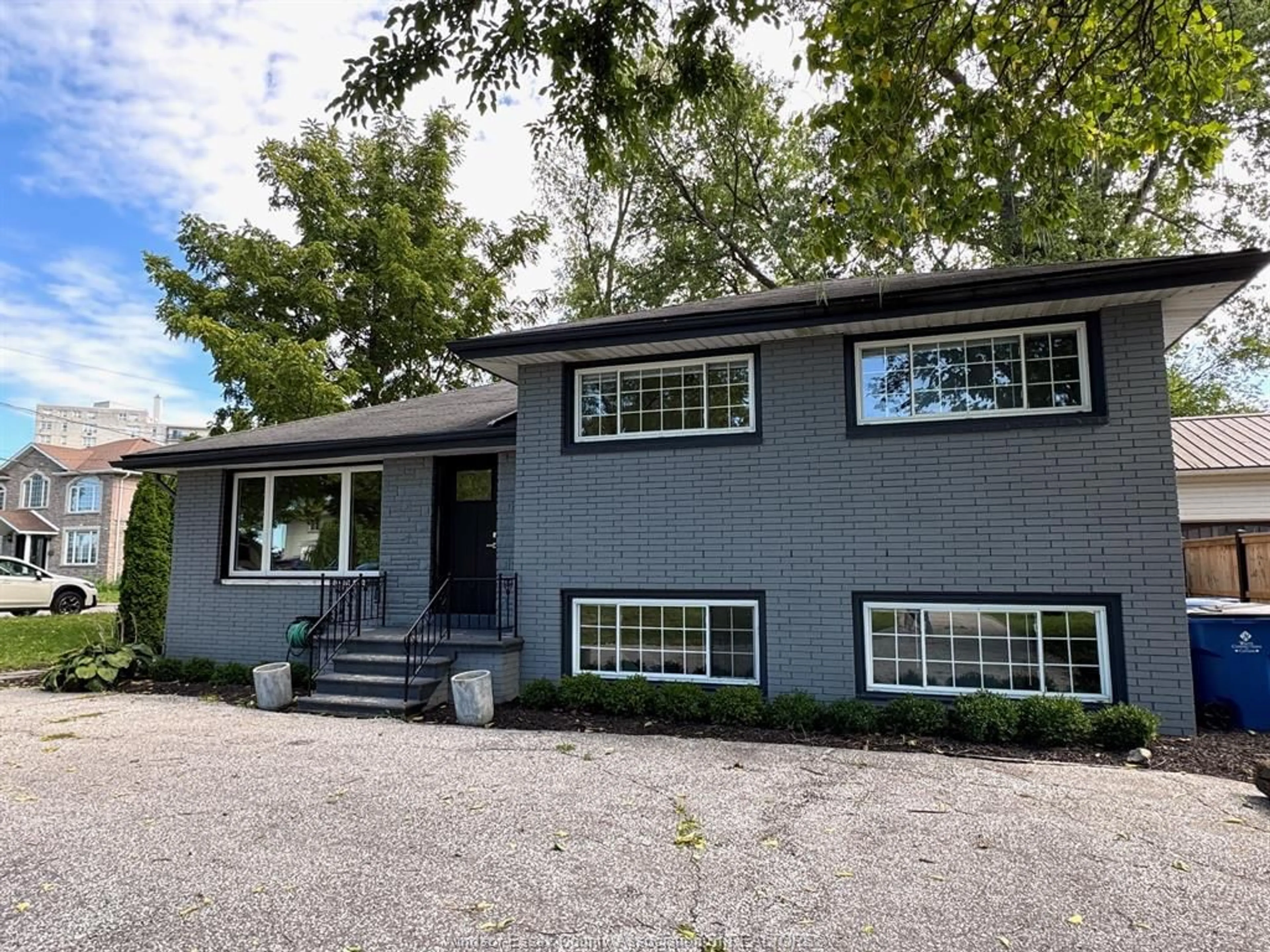 Home with vinyl exterior material, street for 8177 RIVERSIDE Dr, Windsor Ontario N8S 1E5