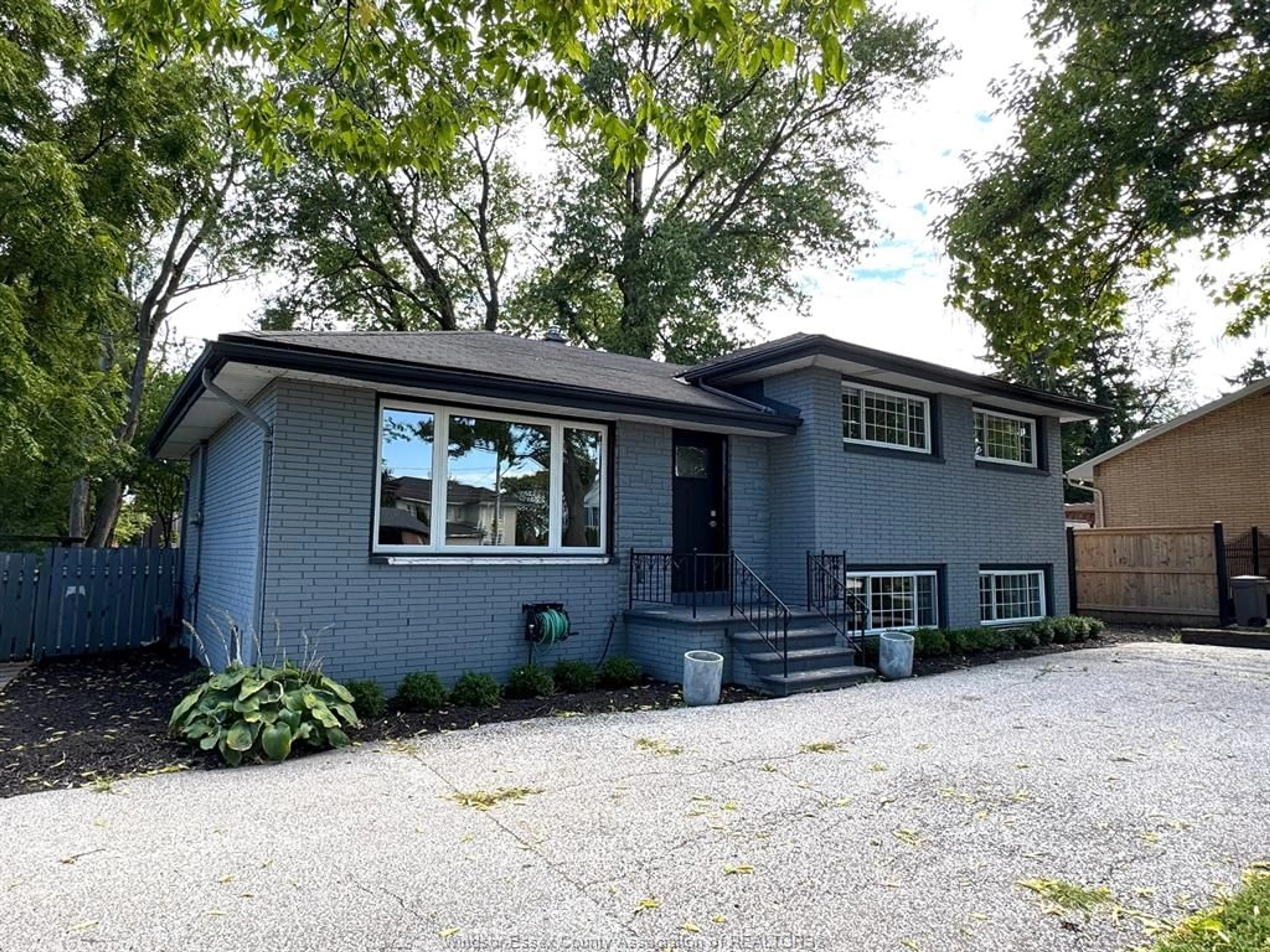 Home with vinyl exterior material, street for 8177 RIVERSIDE Dr, Windsor Ontario N8S 1E5