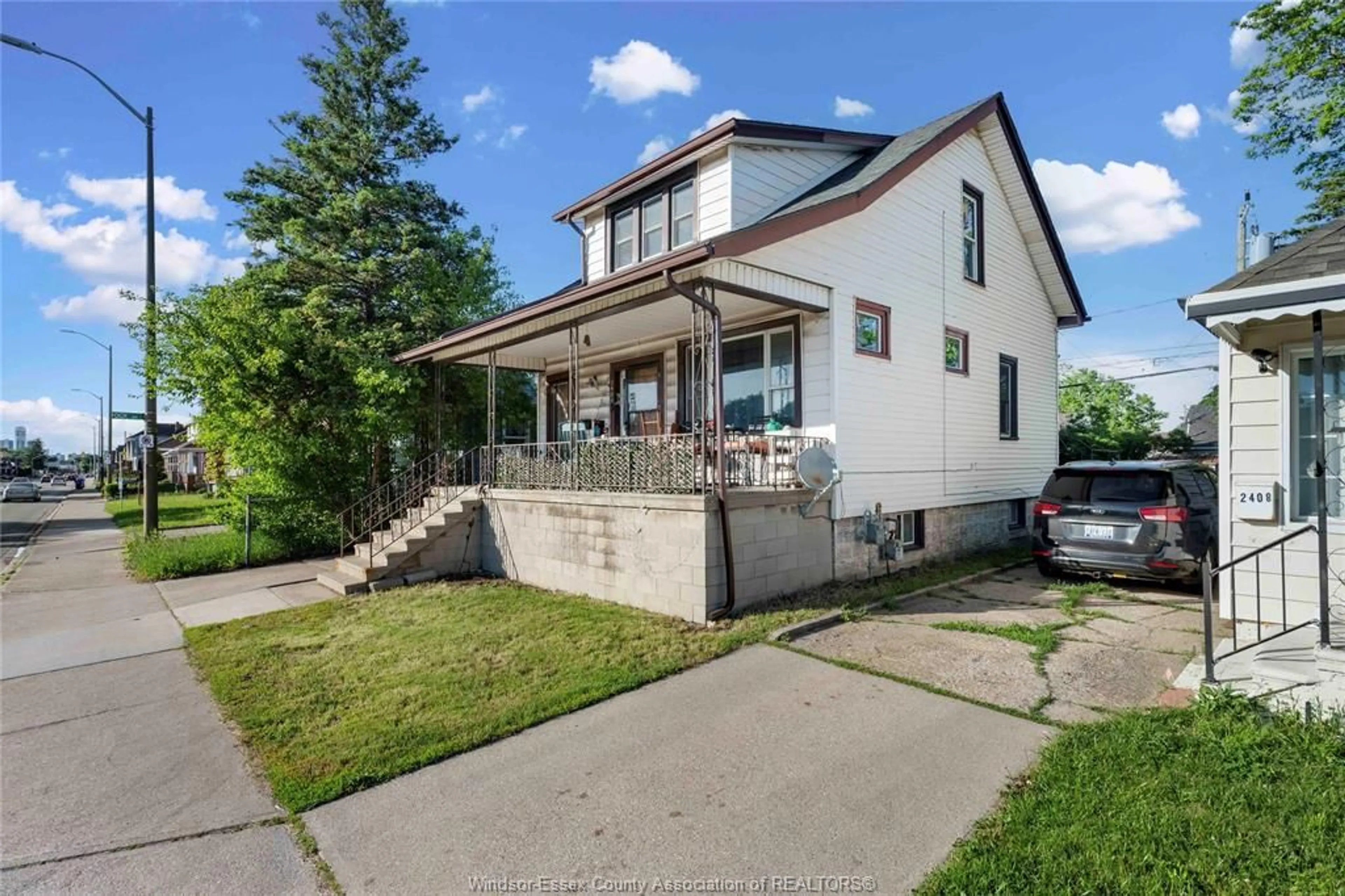 Home with brick exterior material, street for 2404 Howard Ave, Windsor Ontario N8T 2M1