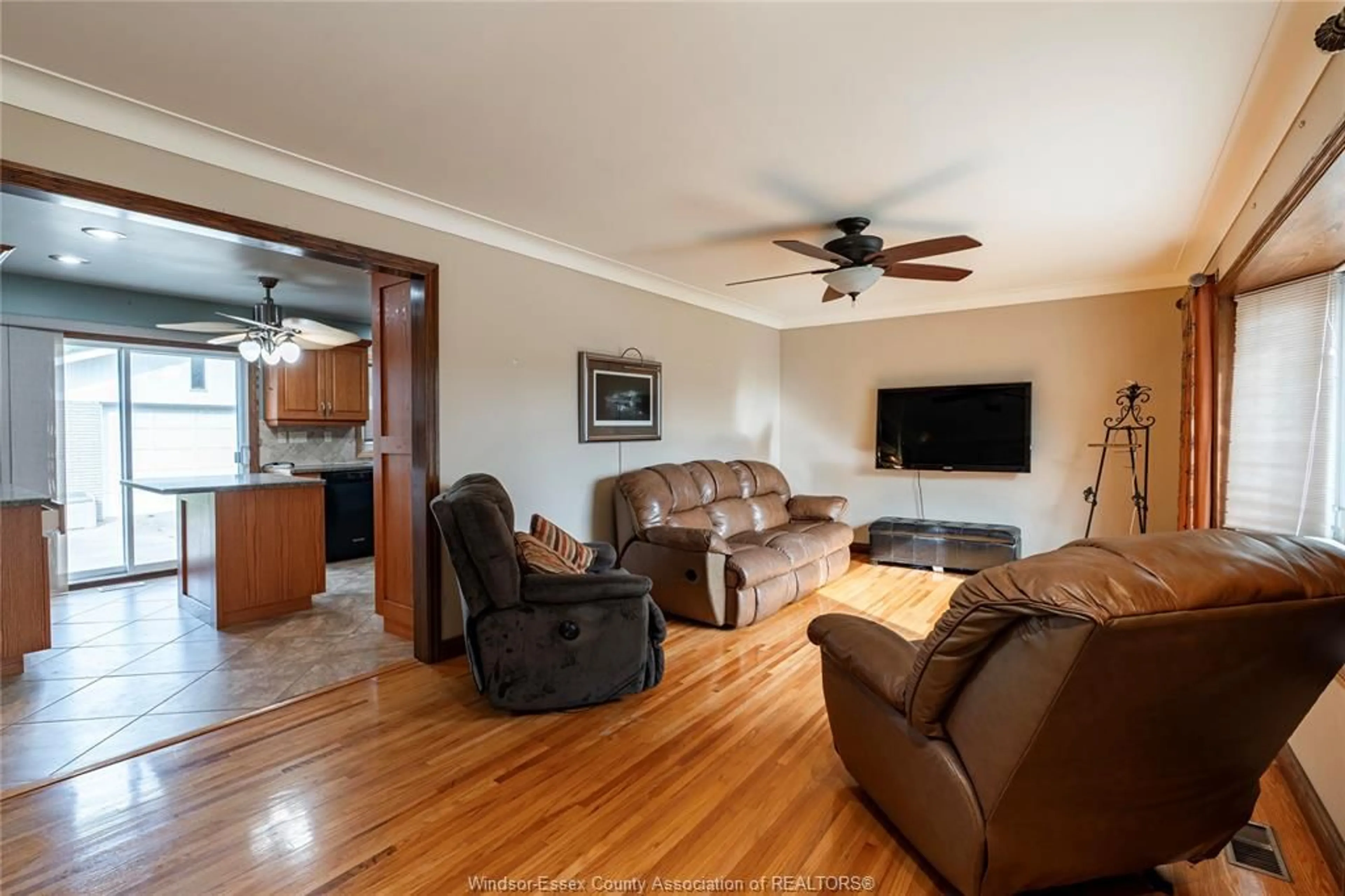 Living room with furniture, wood/laminate floor for 583 BERTHA, Windsor Ontario N8P 1B6