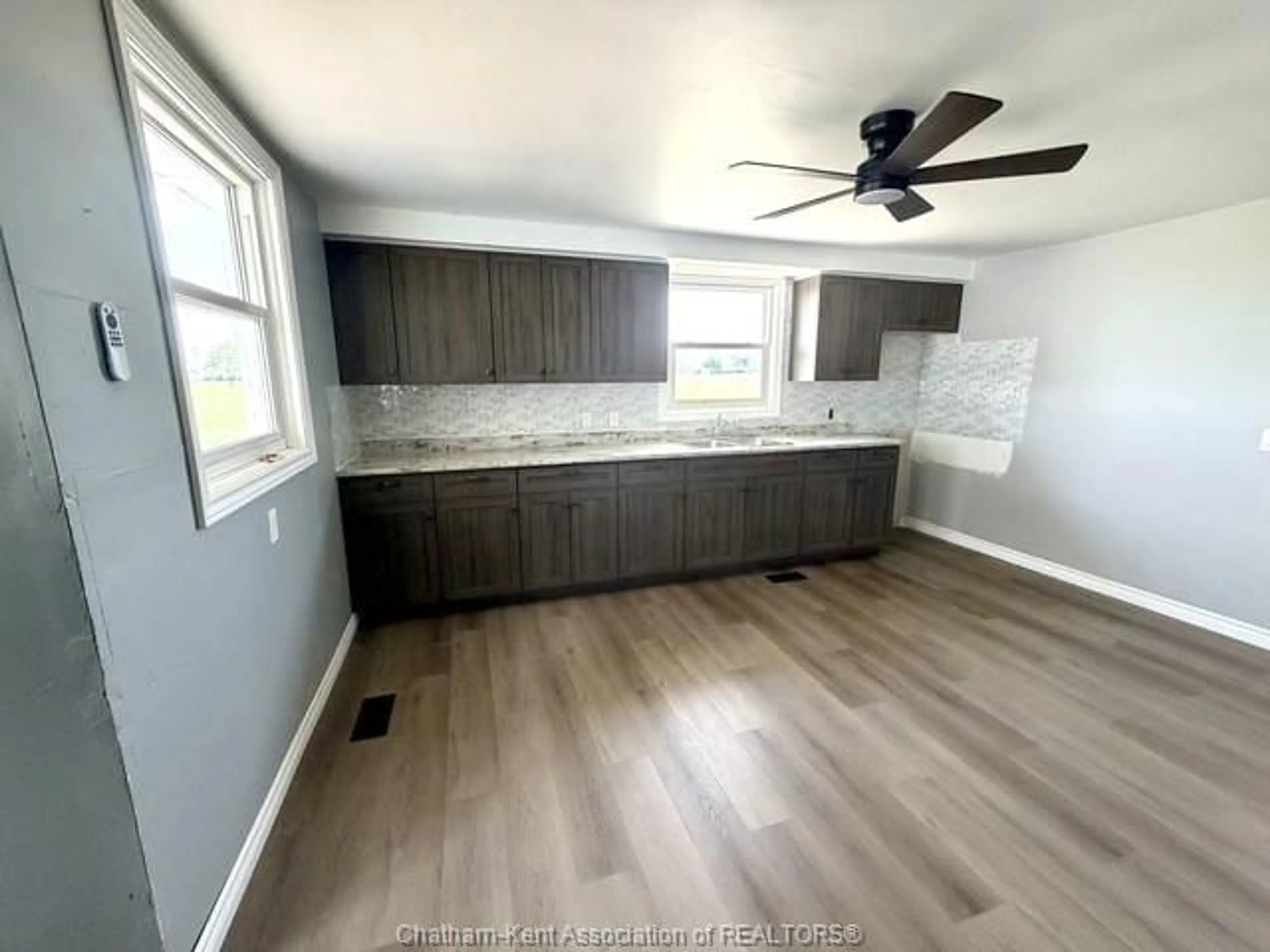 Open concept kitchen, wood/laminate floor for 10817 Knights Line, Blenheim Ontario N0P 1A0
