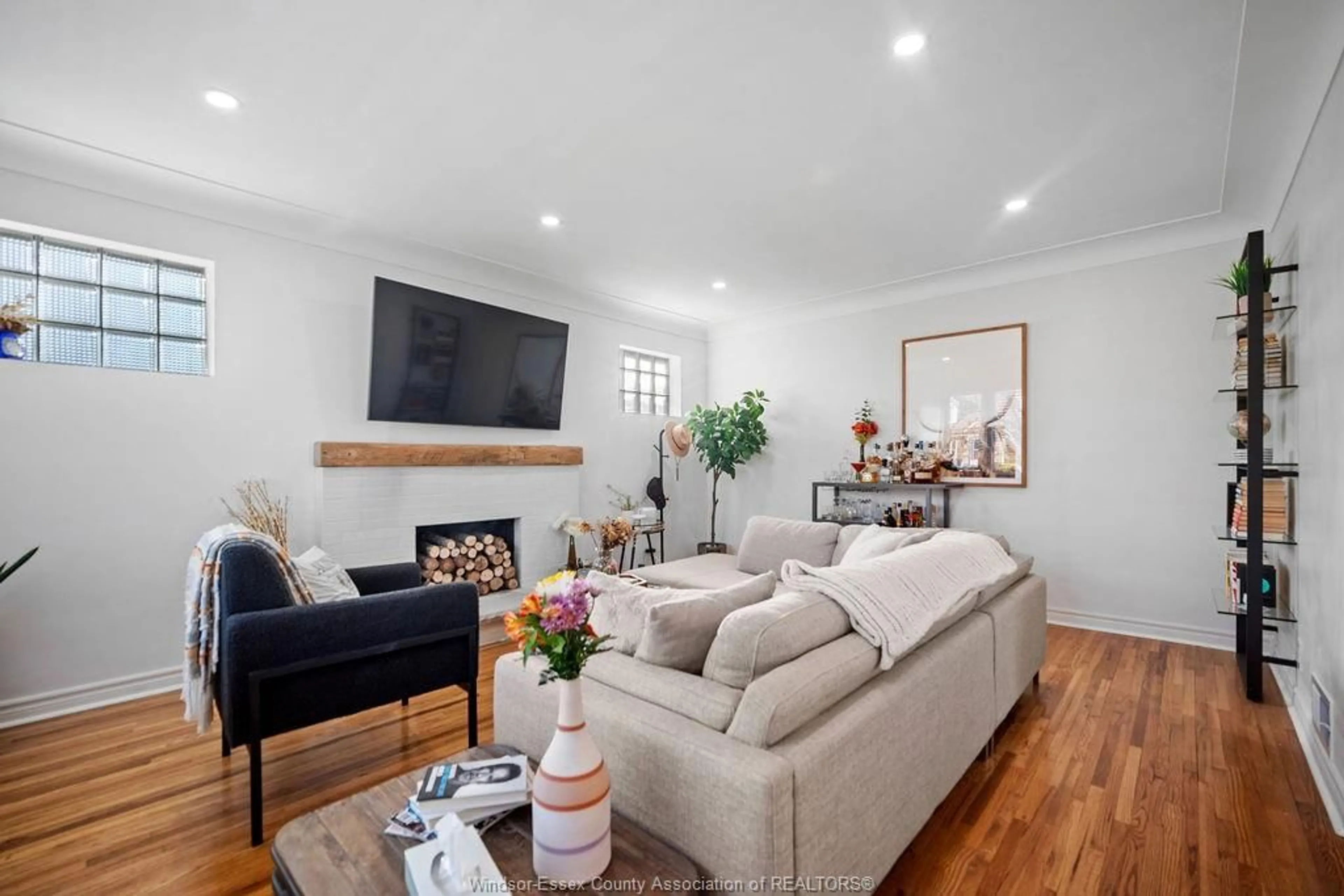 Living room with furniture, wood/laminate floor for 7529 ST ROSE, Windsor Ontario N8S 1Y6
