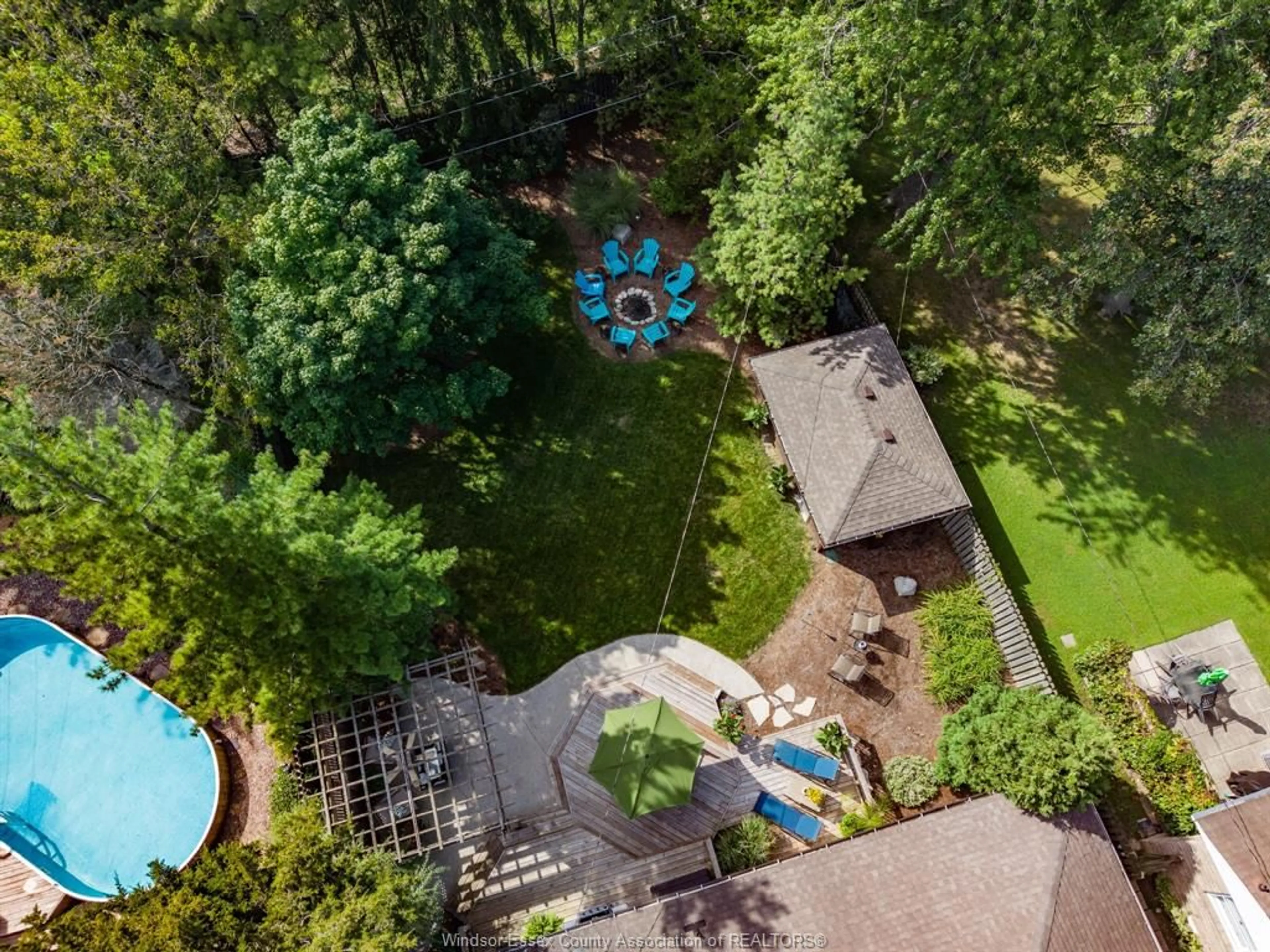 A pic from outside/outdoor area/front of a property/back of a property/a pic from drone, forest/trees view for 345 GRACE Rd, Tecumseh Ontario N8N 2G6