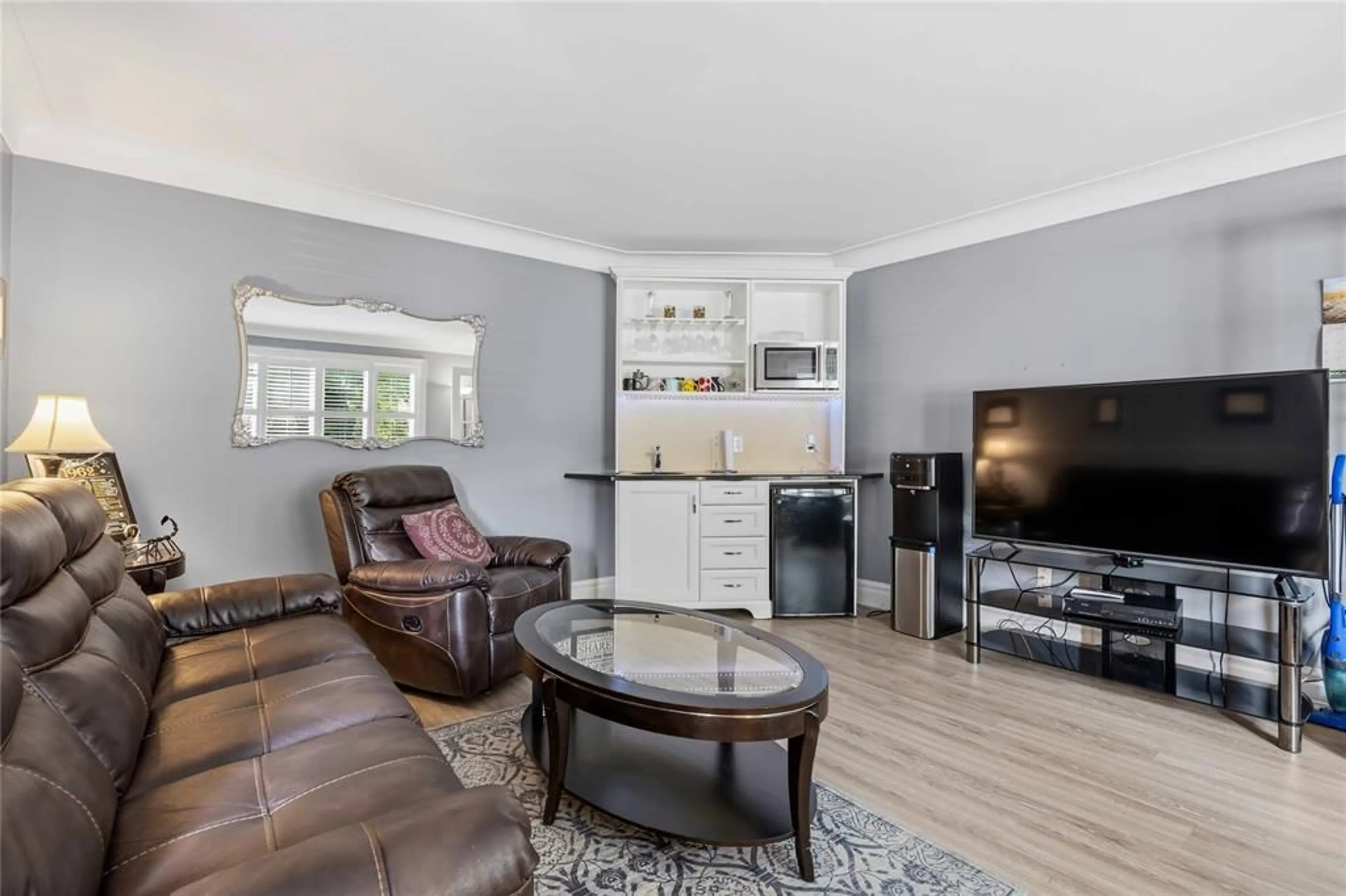 Living room with furniture, wood/laminate floor for 1876 CLARENCE St, Sarnia Ontario N7X 1C8
