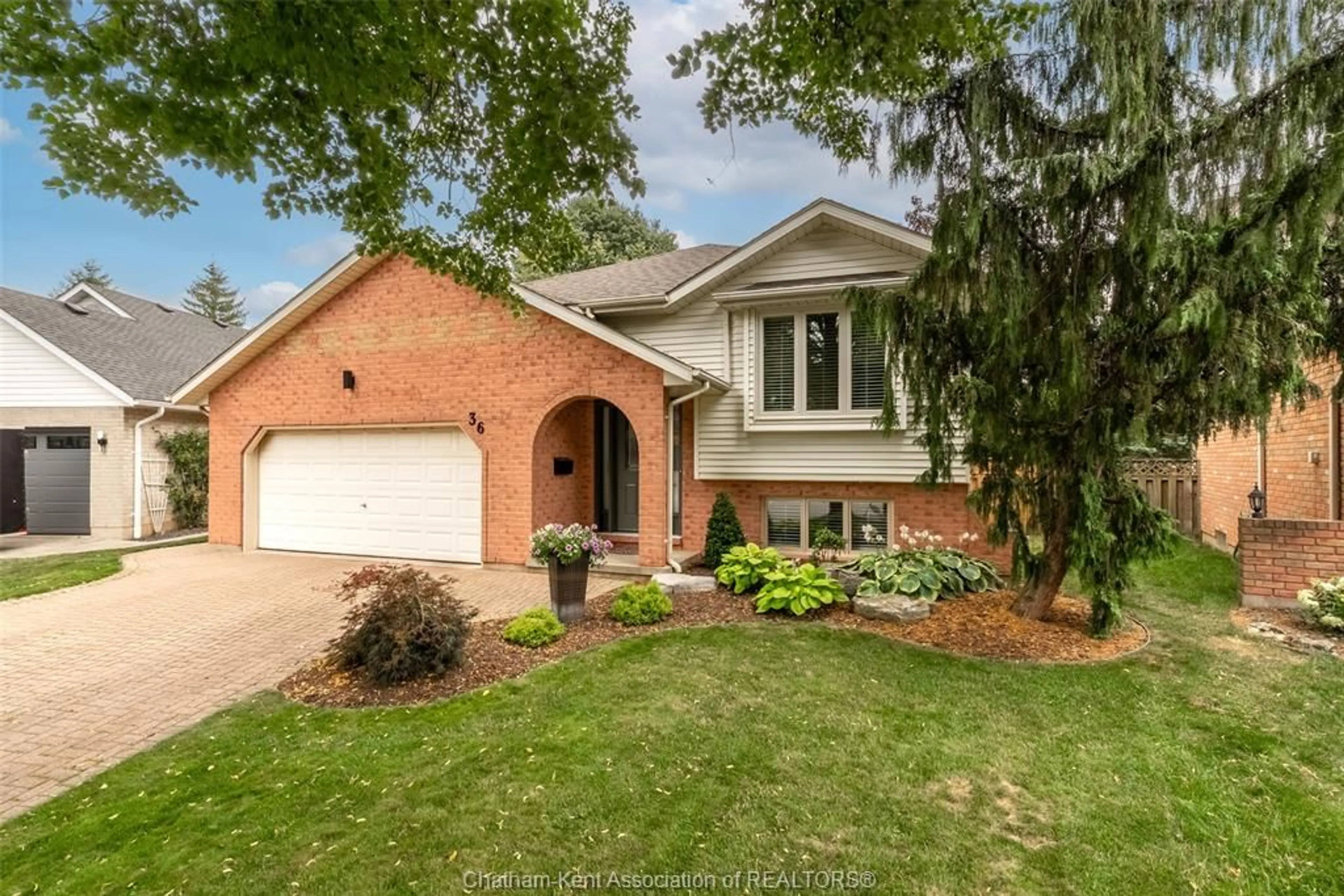 Home with brick exterior material, street for 36 Plantation Pl, Chatham Ontario N7M 6G7