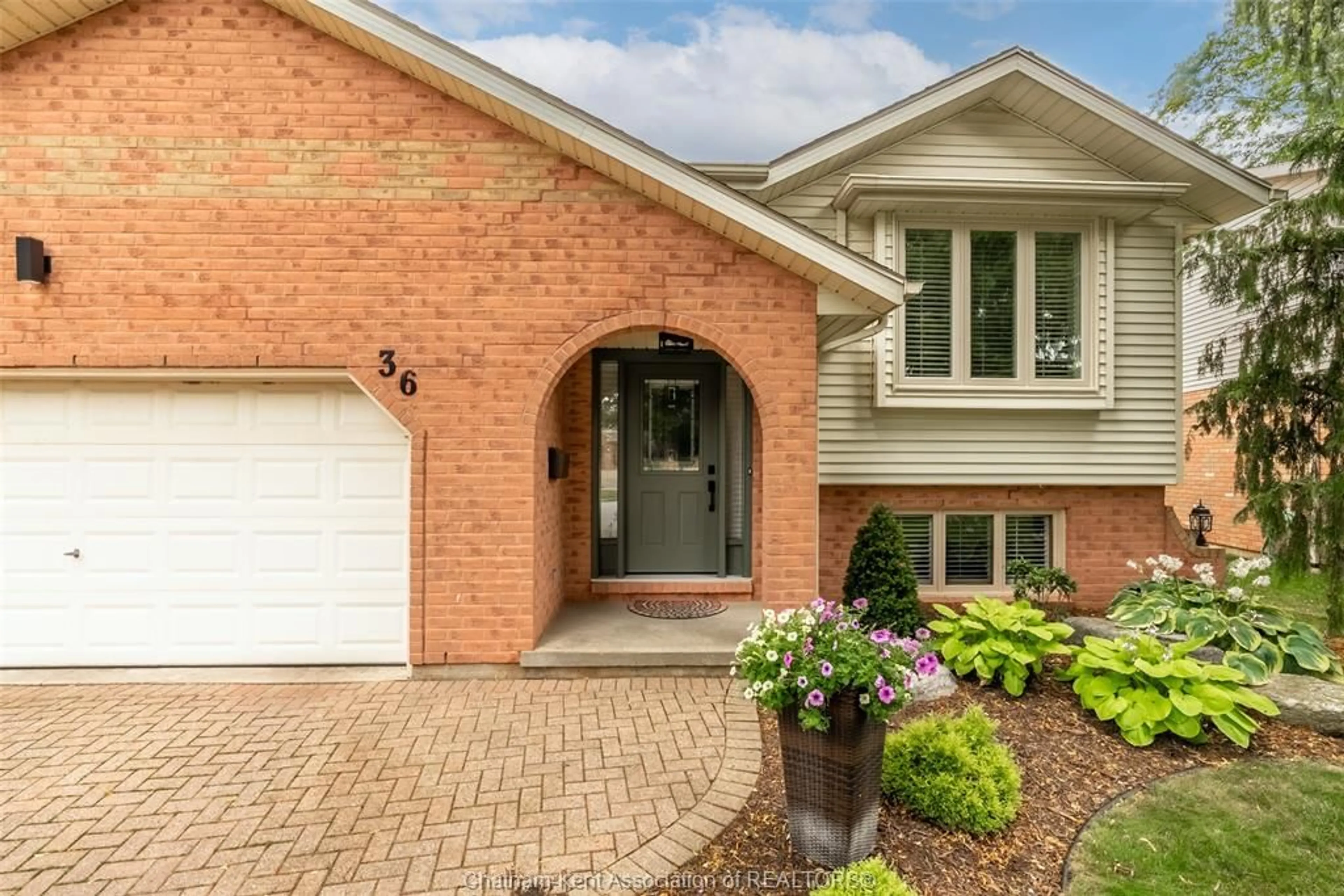 Home with brick exterior material, street for 36 Plantation Pl, Chatham Ontario N7M 6G7