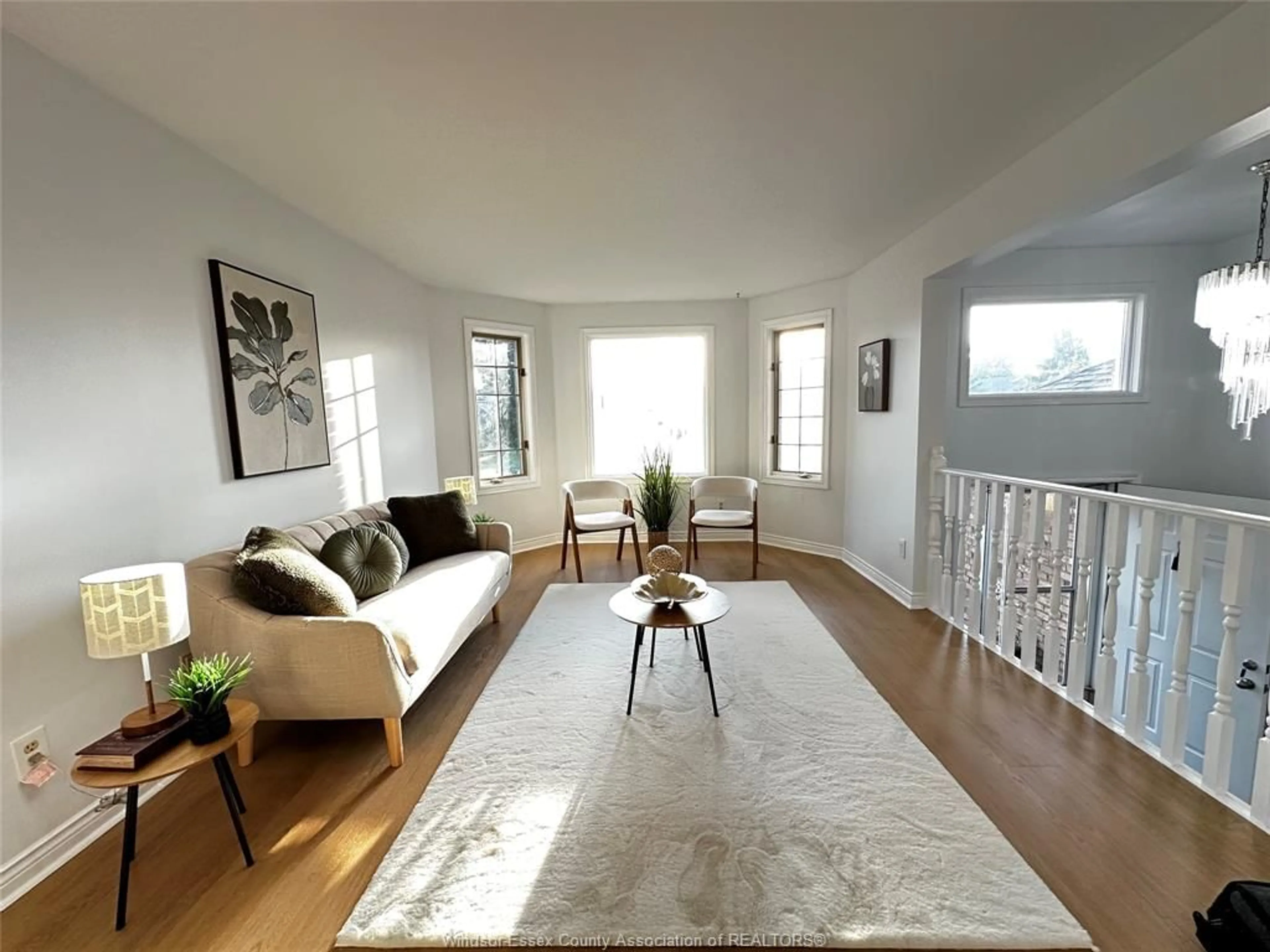 Living room with furniture, wood/laminate floor for 3025 KENILWORTH, Windsor Ontario N9E 4M1