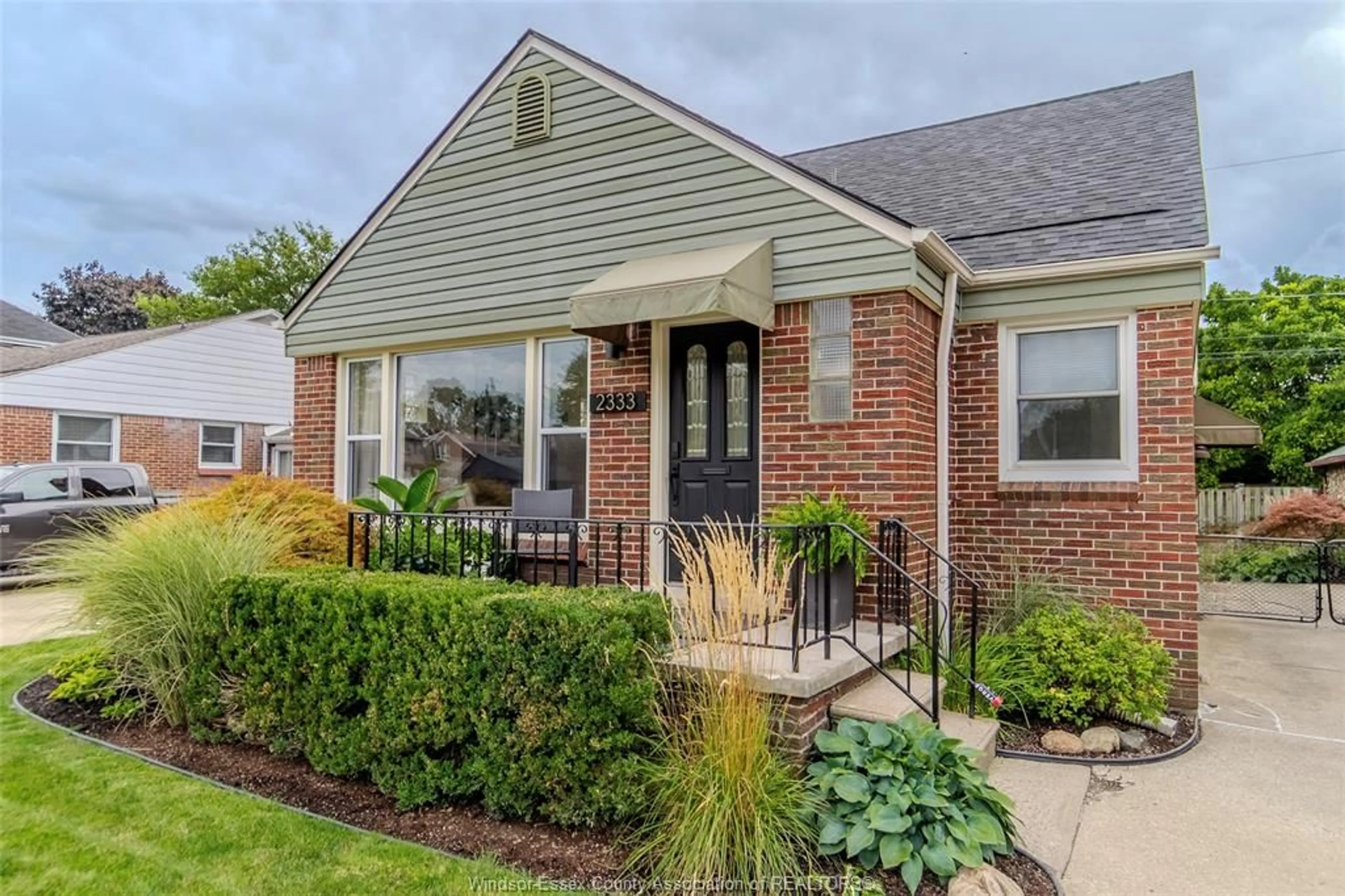 Home with brick exterior material, street for 2333 Kildare Rd, Windsor Ontario N8W 2X6