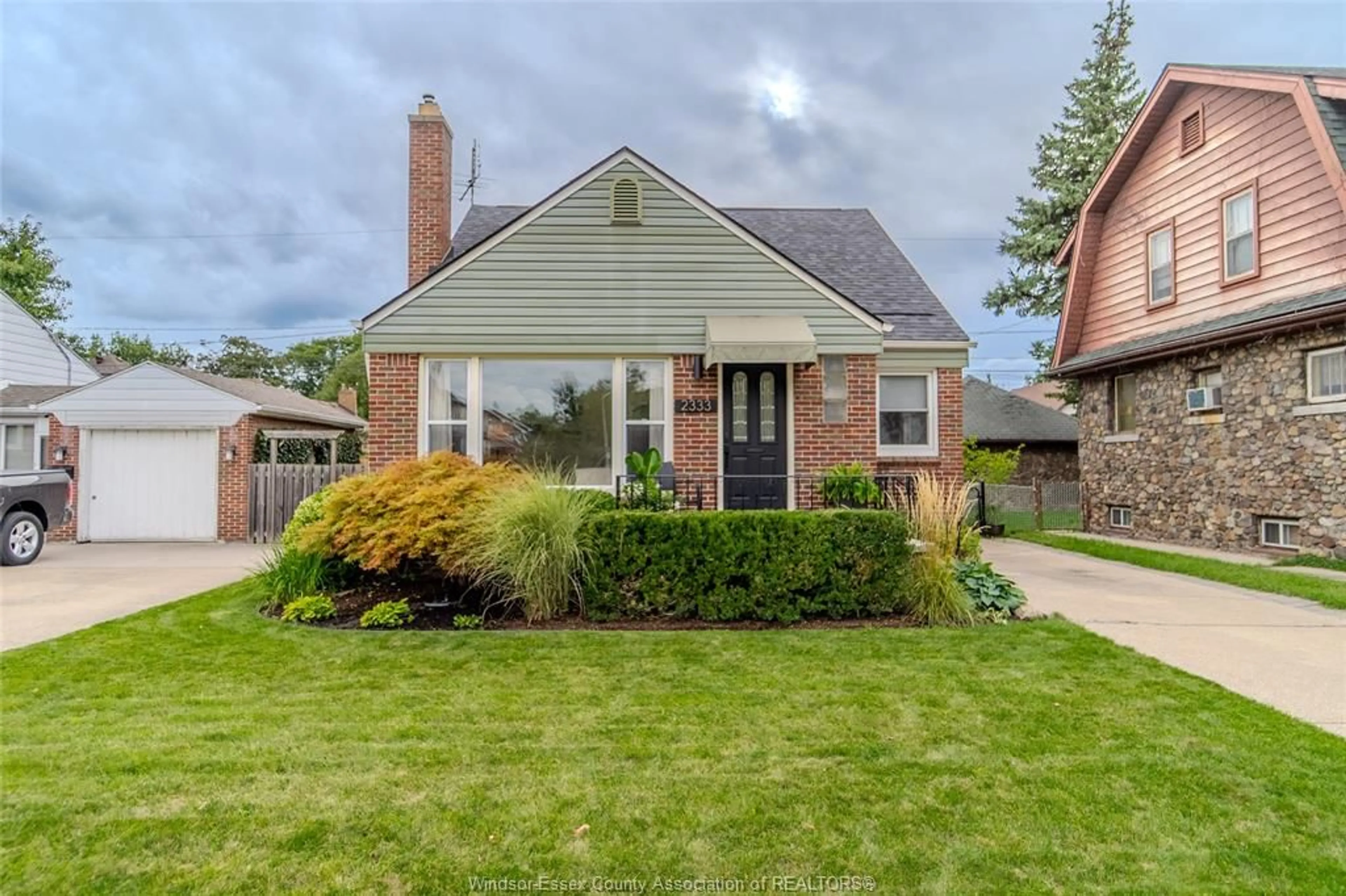 Home with brick exterior material, street for 2333 Kildare Rd, Windsor Ontario N8W 2X6