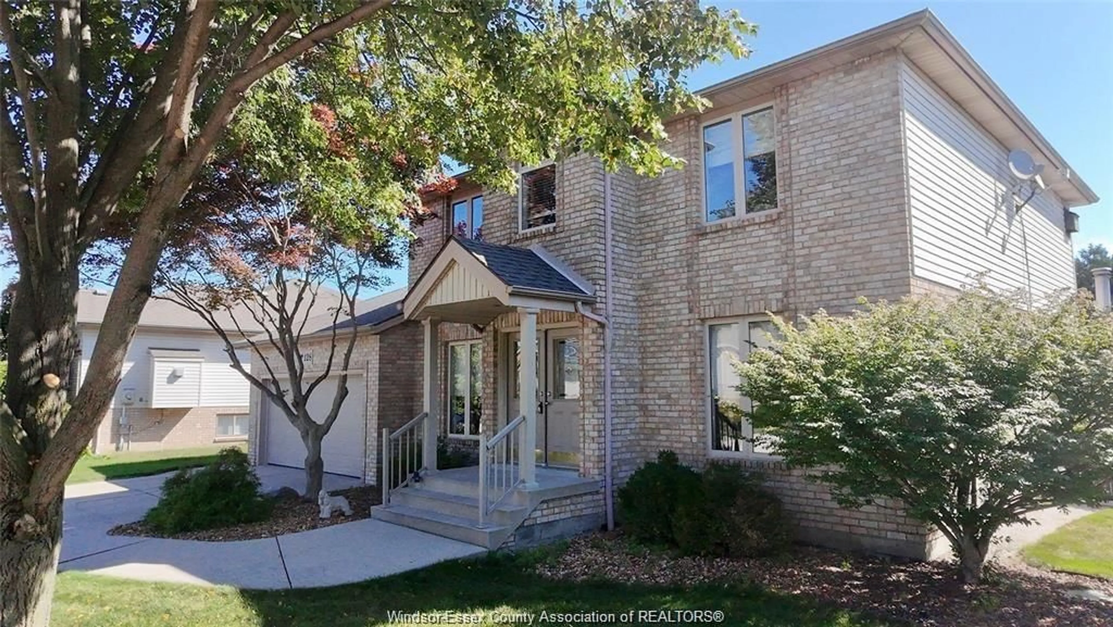 Home with brick exterior material, street for 128 Pheasant Run Dr, Lakeshore Ontario N8L 0Z7