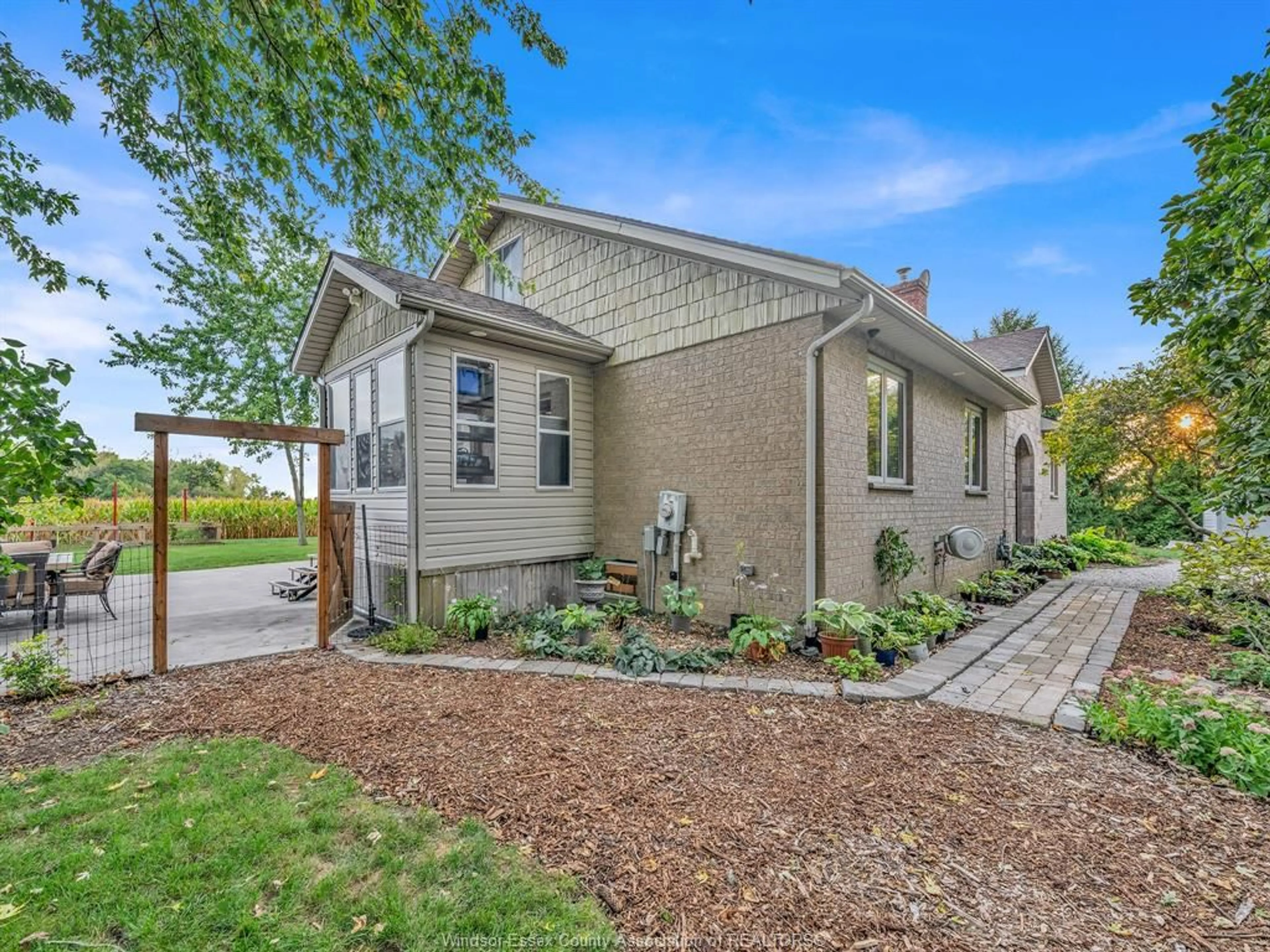 Home with brick exterior material, street for 15461 COUNTY RD 8, Essex Ontario N0R 1L0