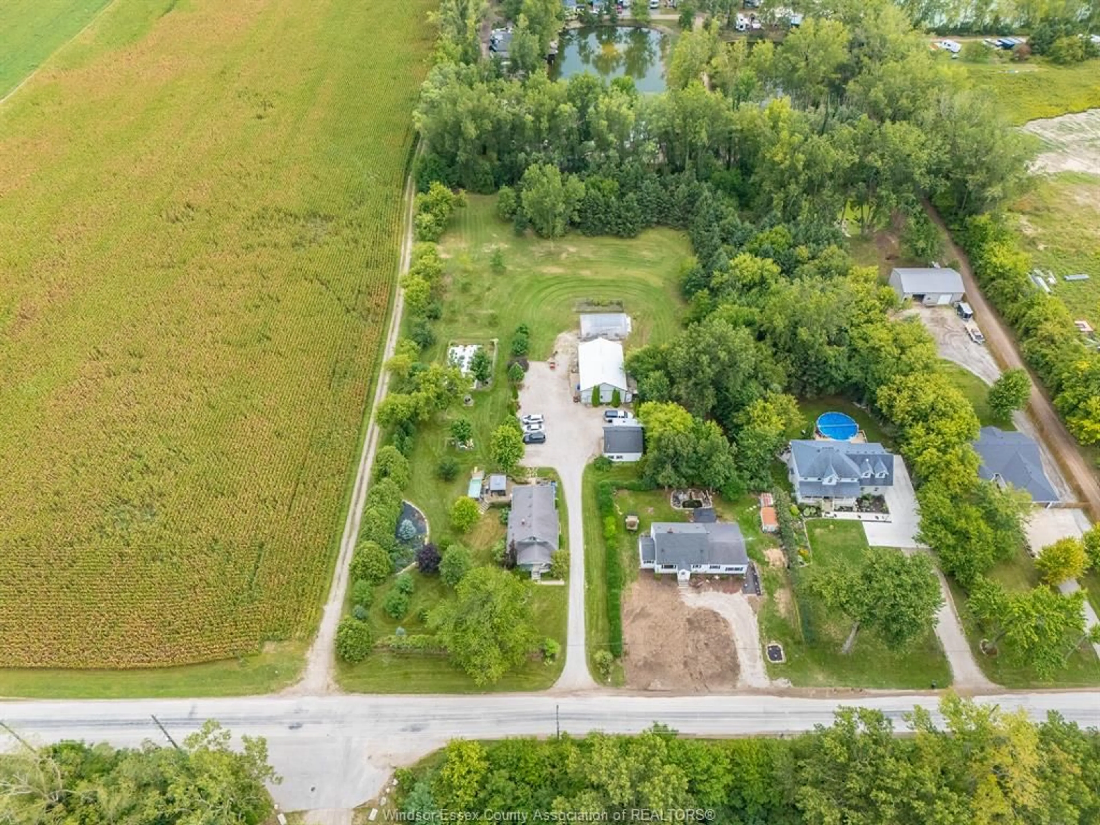 A pic from outside/outdoor area/front of a property/back of a property/a pic from drone, street for 136 MERSEA ROAD 5, Leamington Ontario N8H 3V5