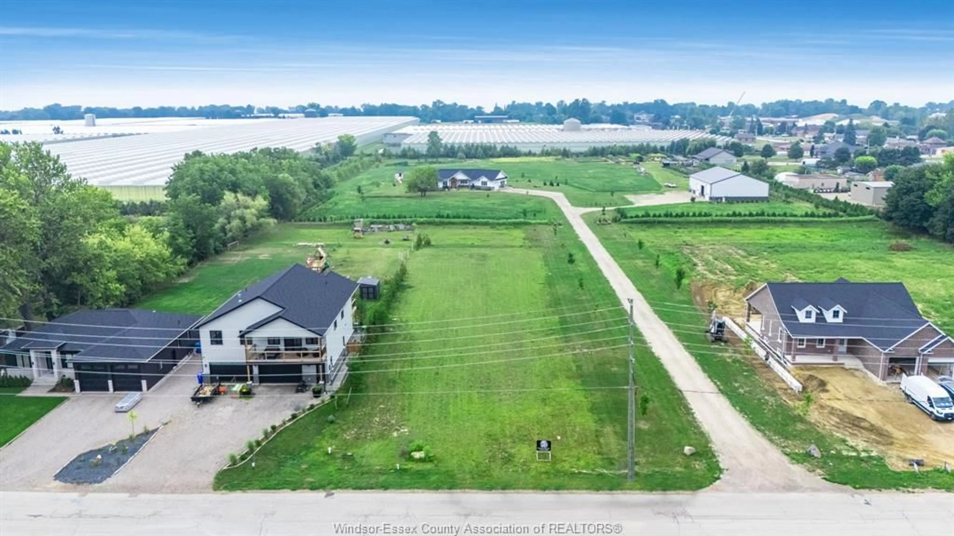 A pic from outside/outdoor area/front of a property/back of a property/a pic from drone, water/lake/river/ocean view for 1647 Road 2, Kingsville Ontario N0P 2G0
