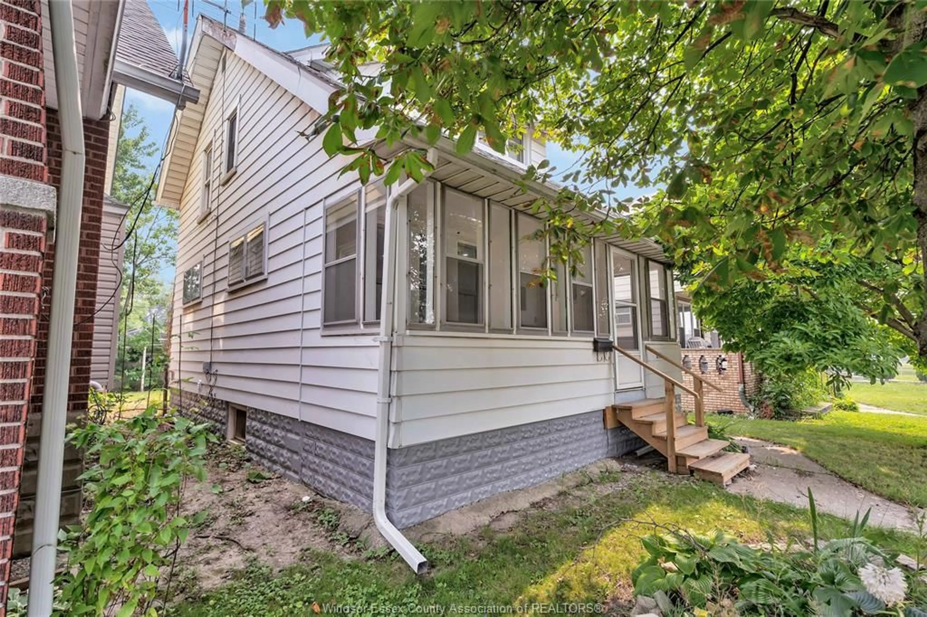 Home with vinyl exterior material, street for 1245 GILES Blvd, Windsor Ontario N9A 4G7